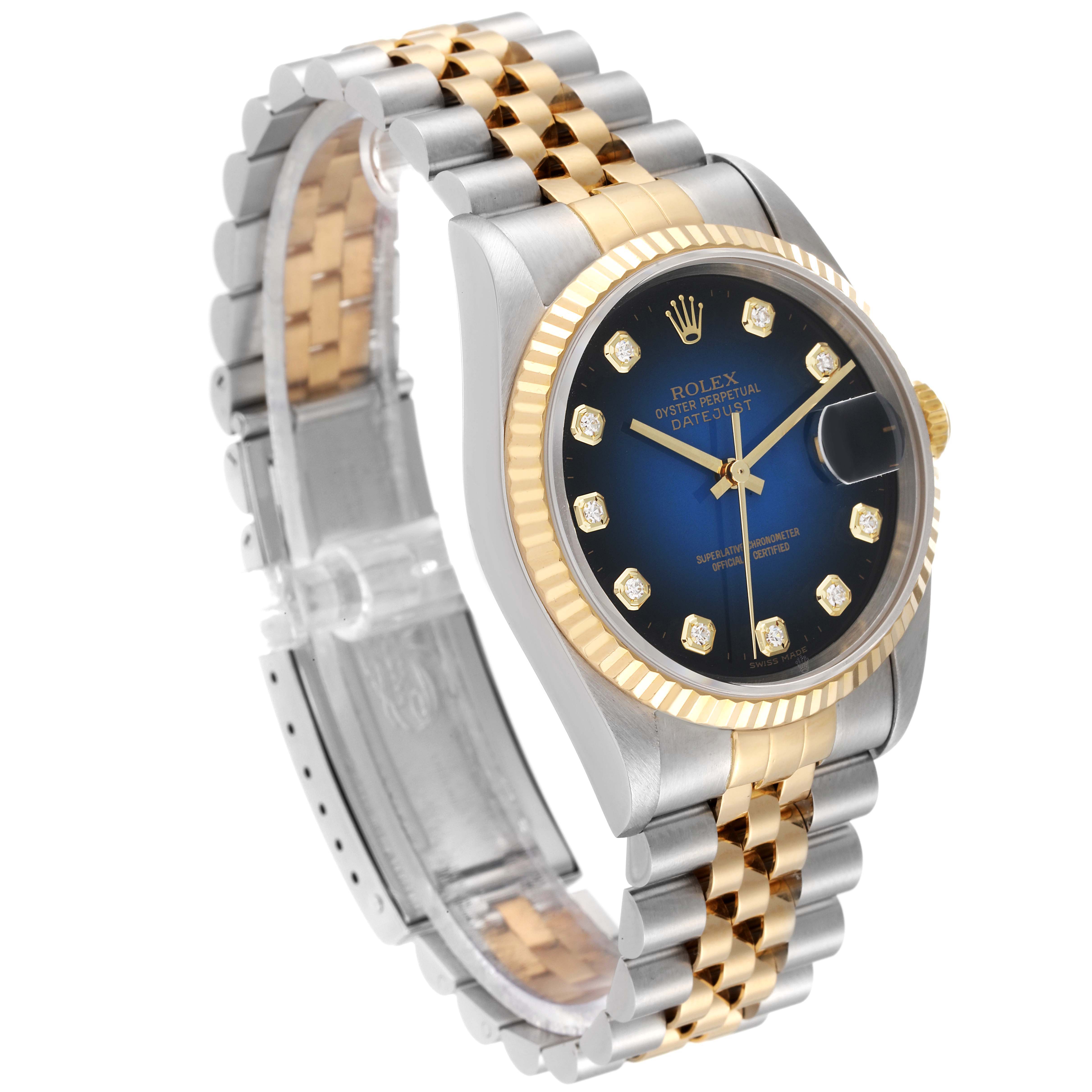 The image shows a Rolex Datejust 16233 Men's Steel and Gold (two tone) Blue Dial 16233 Men's Steel and Gold (two tone) Blue Dial watch at a slight angle, highlighting its blue dial, gold bezel, and two-tone bracelet.