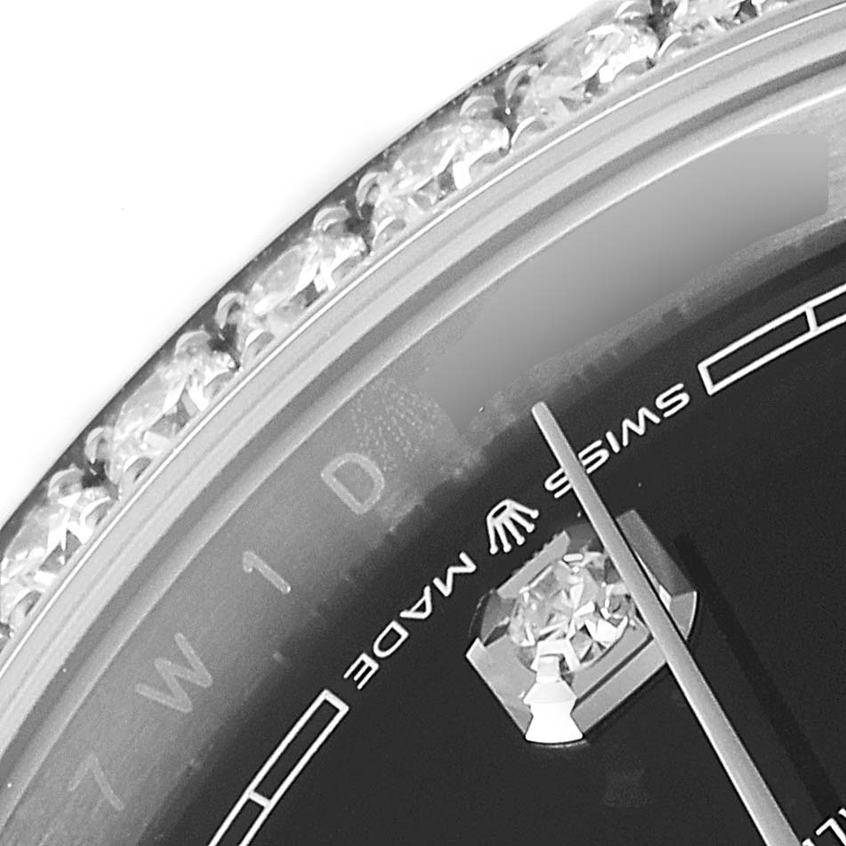 The image shows a close-up of the dial edge, bezel, and hands of a Rolex Datejust 126284RBR Men
s Stainless Steel Black Dial 126284RBR Men
s Stainless Steel Black Dial watch.