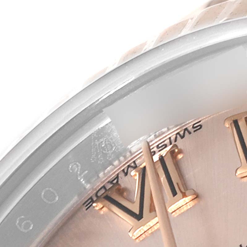 The image shows a close-up of the dial and Roman numerals on a Rolex Datejust 179171 Women's Steel and Gold (two tone) Pink Dial 179171 Women's Steel and Gold (two tone) Pink Dial watch.