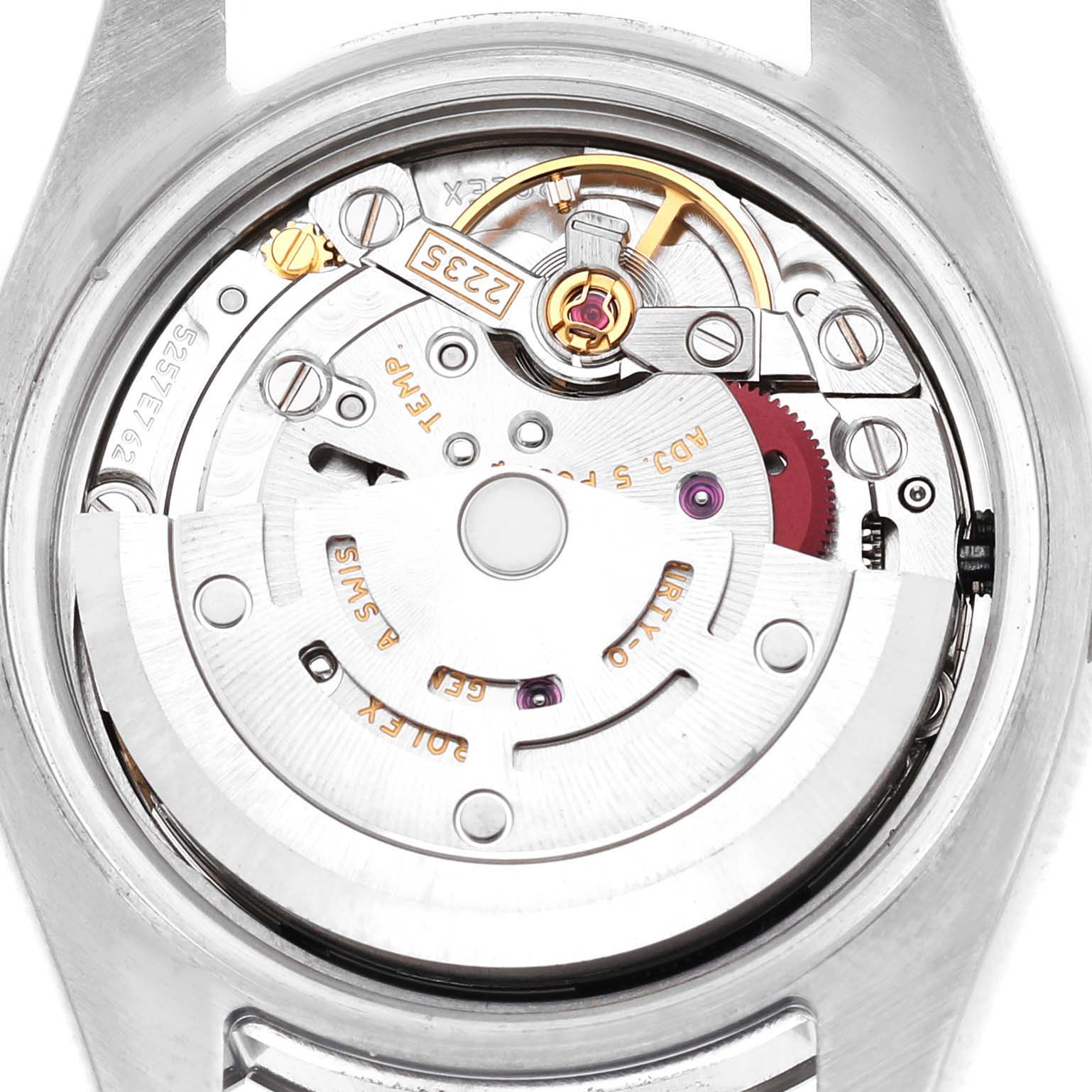 The image shows the Rolex Datejust 179174 Women's Stainless Steel Black Dial watch's movement from the back, displaying internal mechanical components and engravings.
