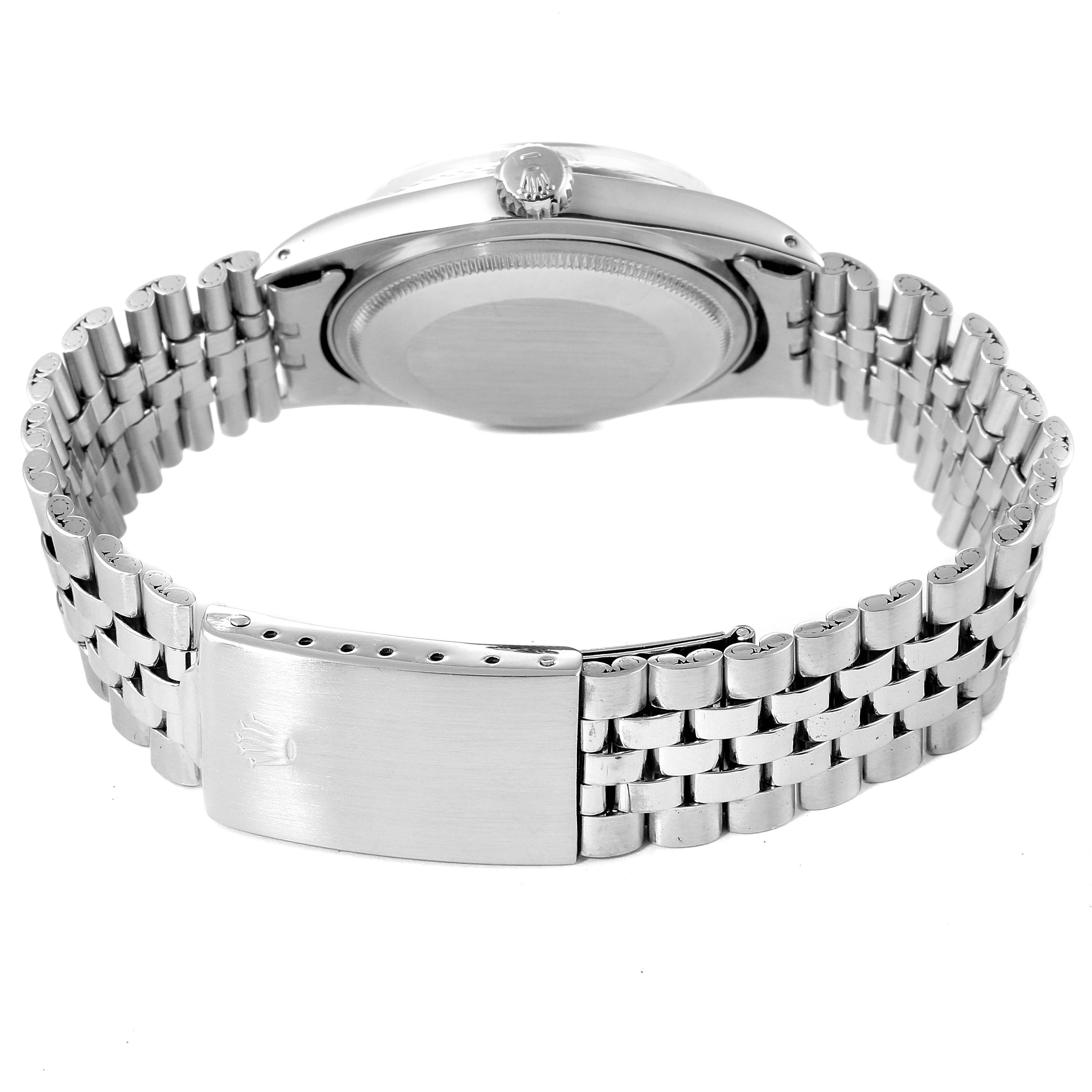 This image shows the back case, crown, and bracelet of a Rolex Vintage Collection 1601 Men's Stainless Steel Blue Dial 1601 Men's Stainless Steel Blue Dial watch.