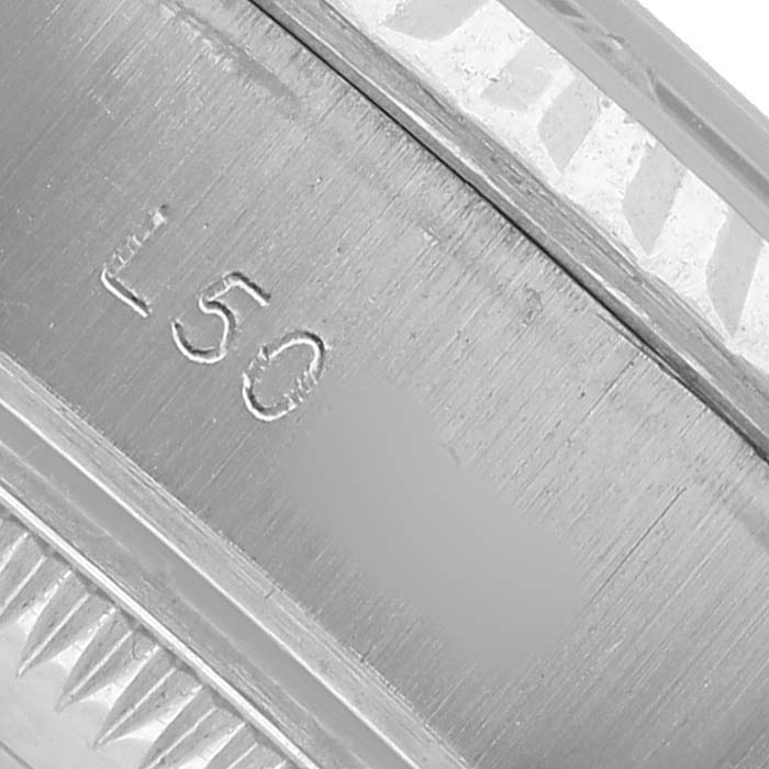 The image shows a close-up of the engraved inner bezel of a Rolex Datejust 69174 Women's Stainless Steel Silver Dial watch.