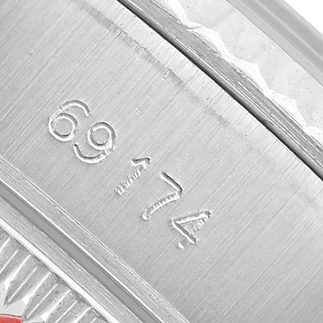 The image shows a close-up of the engraved part of a Rolex Datejust 69174 Women's Stainless Steel Silver Dial watch bezel or inner case.
