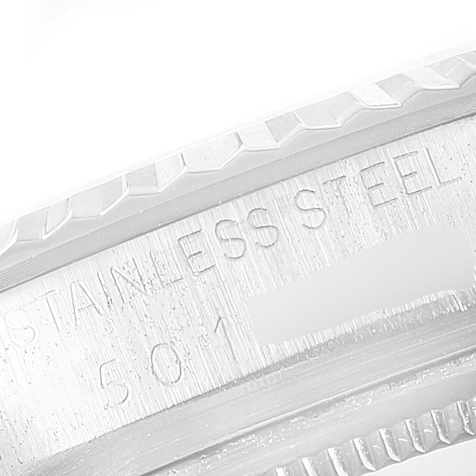 The image shows a detailed close-up of the side of the casing on a Vintage Collection model by Rolex, featuring stainless steel engravings.