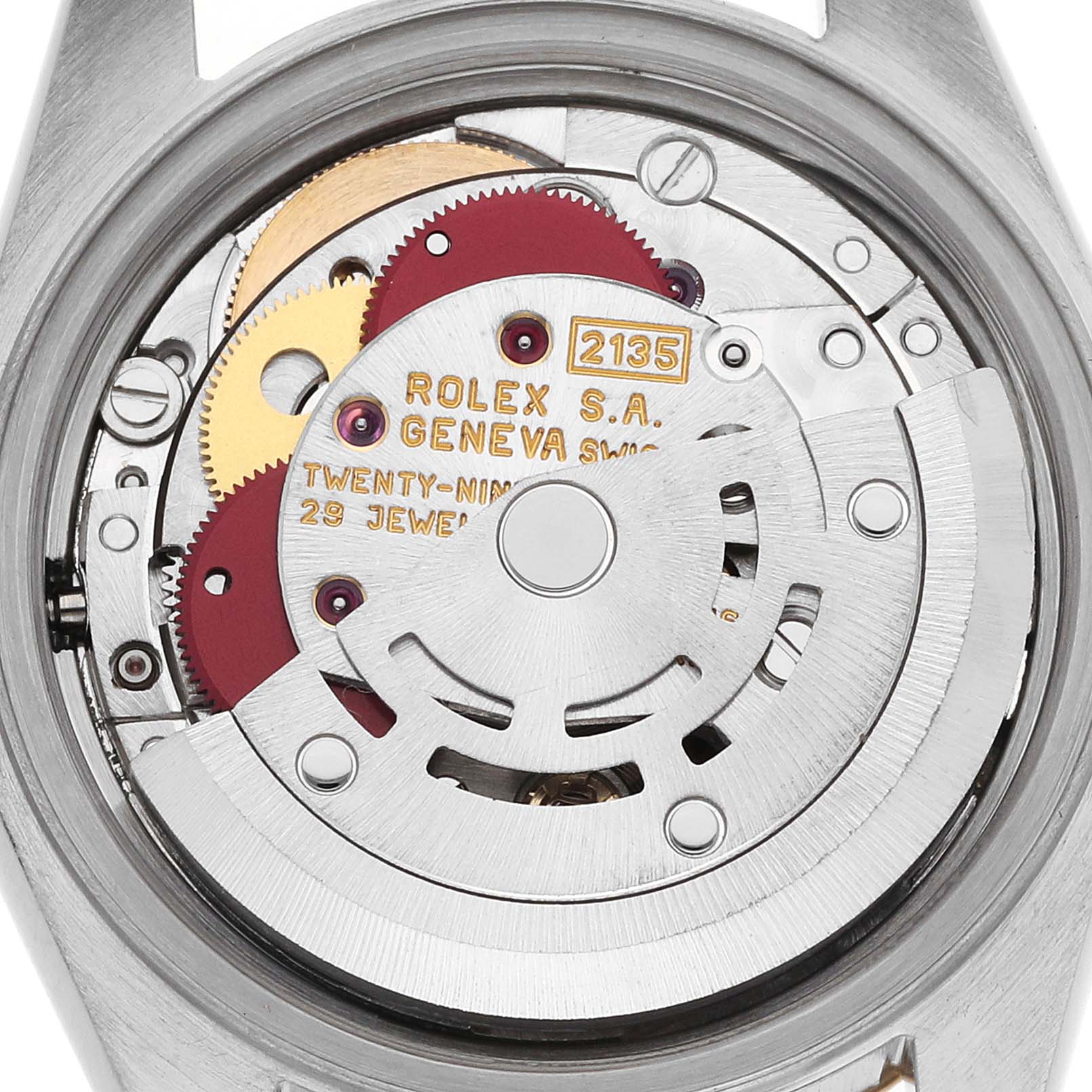 The image shows the internal movement of a Rolex Datejust 69173 Women's Steel and Gold (two tone) Champagne Dial watch, viewed from the back, highlighting its intricate gears and rotor.