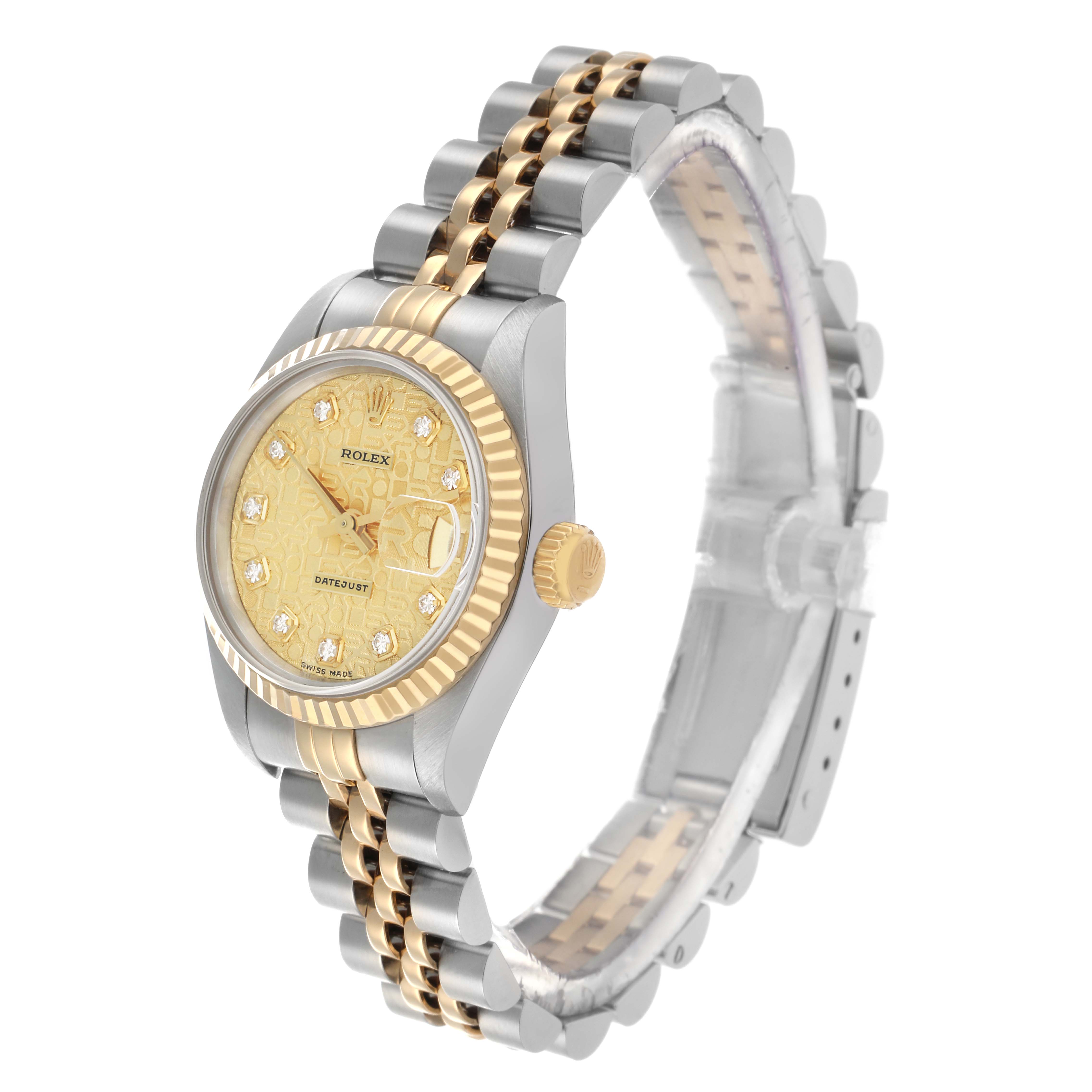 This Rolex Datejust 69173 Women's Steel and Gold (two tone) Champagne Dial watch is shown at an angled side view, highlighting the face, bezel, crown, and Jubilee bracelet.