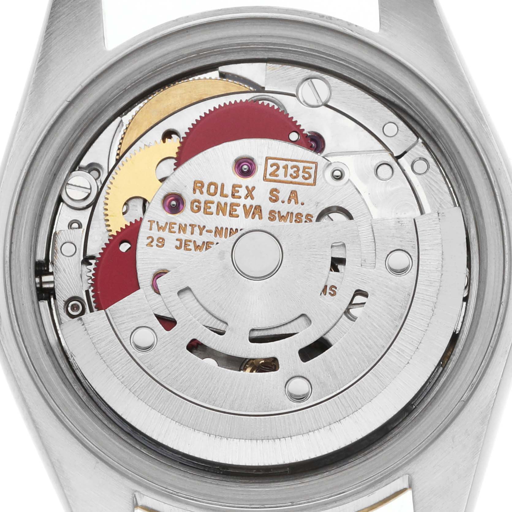 The image shows the inner mechanics of a Rolex Datejust 69173 Women's Steel and Gold (two tone) Champagne Dial watch viewed from the back, highlighting the movement and gears.