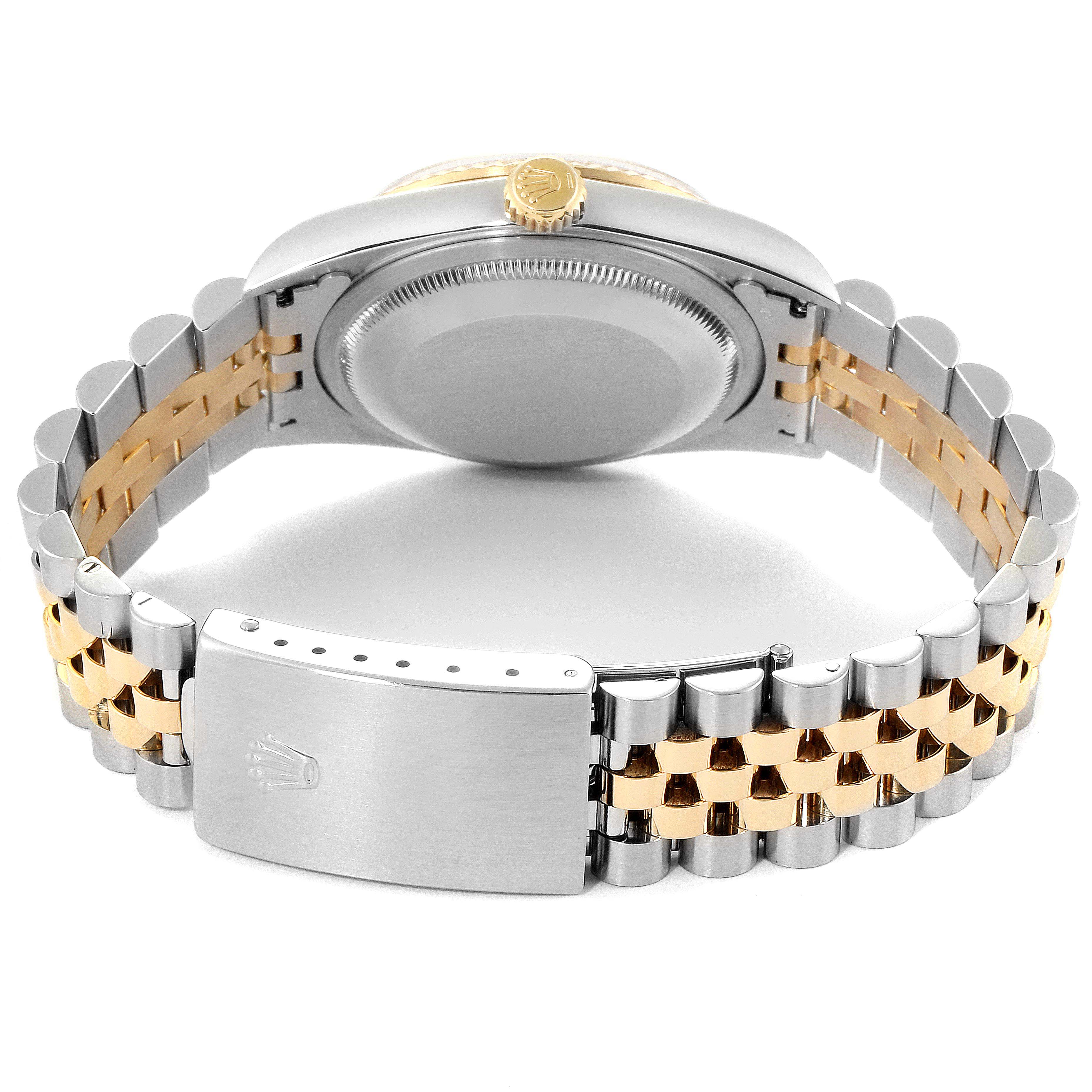 The image shows the back view of a Rolex Datejust 16233 Men's Steel and Gold (two tone) Blue Dial 16233 Men's Steel and Gold (two tone) Blue Dial watch, including the clasp, bracelet, case, and crown.