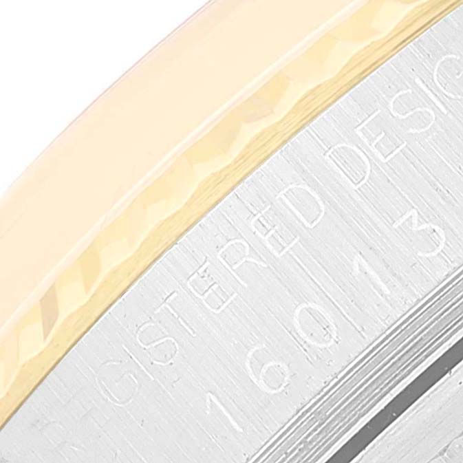 This close-up image shows the engraved text and part of the bezel of a Rolex Vintage Collection 16013 Men's Steel and Gold (two tone) Champagne Dial 16013 Men's Steel and Gold (two tone) Champagne Dial watch.