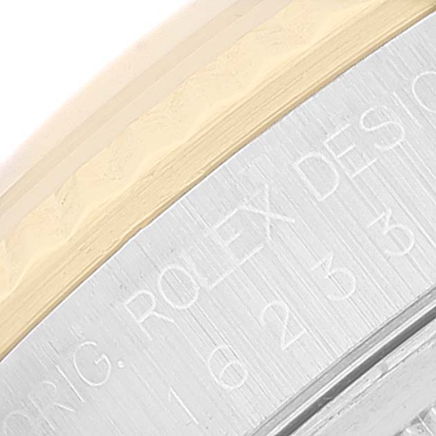 This image shows a close-up of the case rim and part of the bezel of a Rolex Datejust 16233 Men's Steel and Gold (two tone) Champagne Dial 16233 Men's Steel and Gold (two tone) Champagne Dial watch, highlighting the engraved markings.
