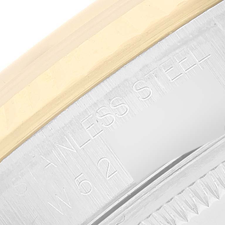 The image shows a close-up of the stainless steel engraving on the bezel of a Rolex Datejust 16233 Men's Steel and Gold (two tone) Champagne Dial 16233 Men's Steel and Gold (two tone) Champagne Dial watch.