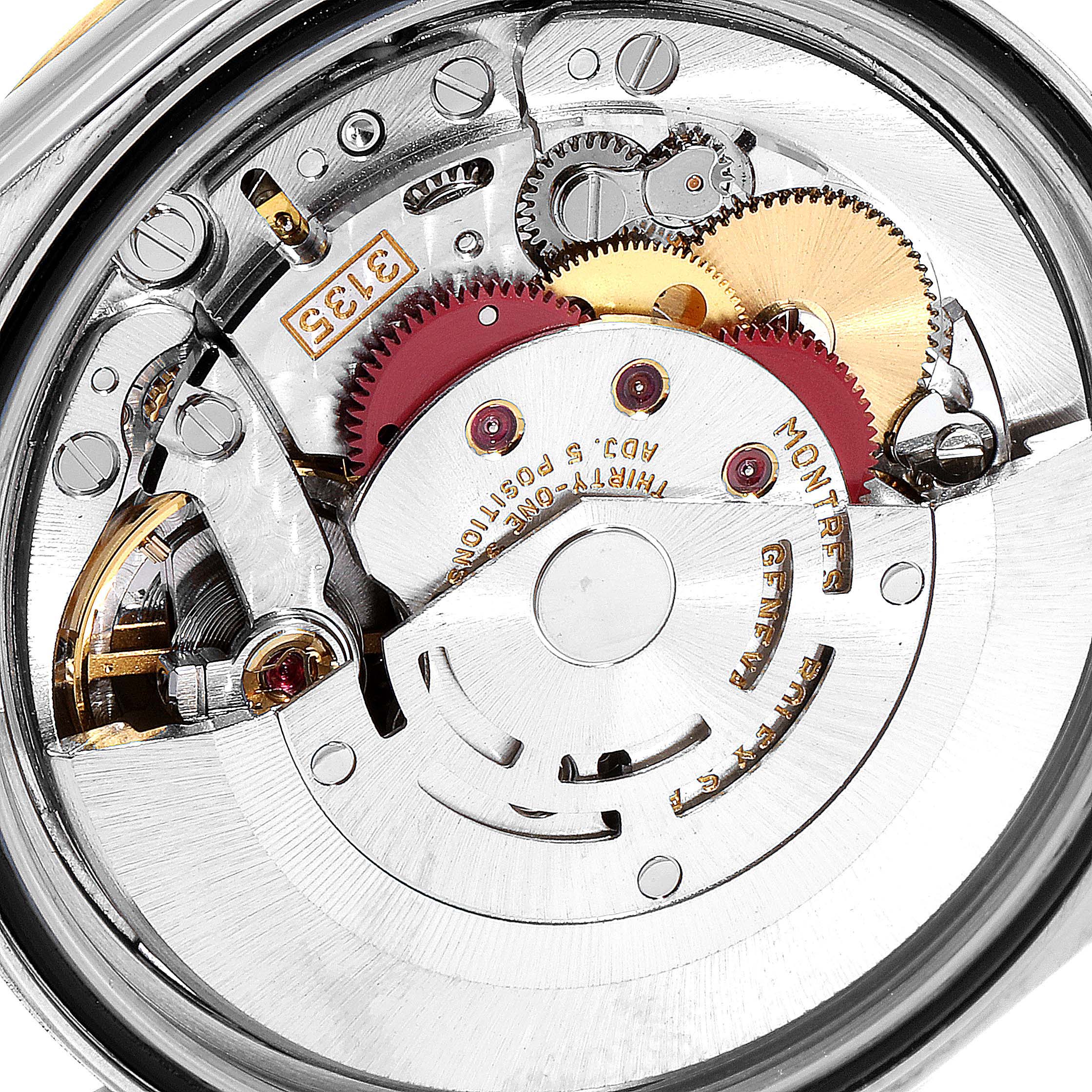 This is a close-up view of the Rolex Datejust 16233 Men's Steel and Gold (two tone) Blue Dial 16233 Men's Steel and Gold (two tone) Blue Dial watch movement, showing the intricate gears and mechanisms from the back.