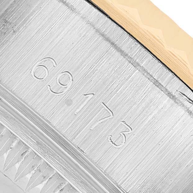 The image shows the side of a Rolex Datejust 69173 Women's Steel and Gold (two tone) Silver Dial watch case, highlighting the model number engraving.