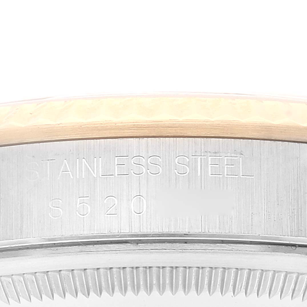 The image shows a close-up of the side of the bezel and case back of a Rolex Datejust 16233 Men
s Steel and Gold (two tone) Grey Dial 16233 Men
s Steel and Gold (two tone) Grey Dial watch, highlighting the stainless steel marking.