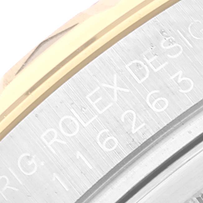 The image shows a close-up of the side engraving on a Rolex Turn-o-Graph 116263 Men's Steel and Gold (two tone) White Dial 116263 Men's Steel and Gold (two tone) White Dial watch.