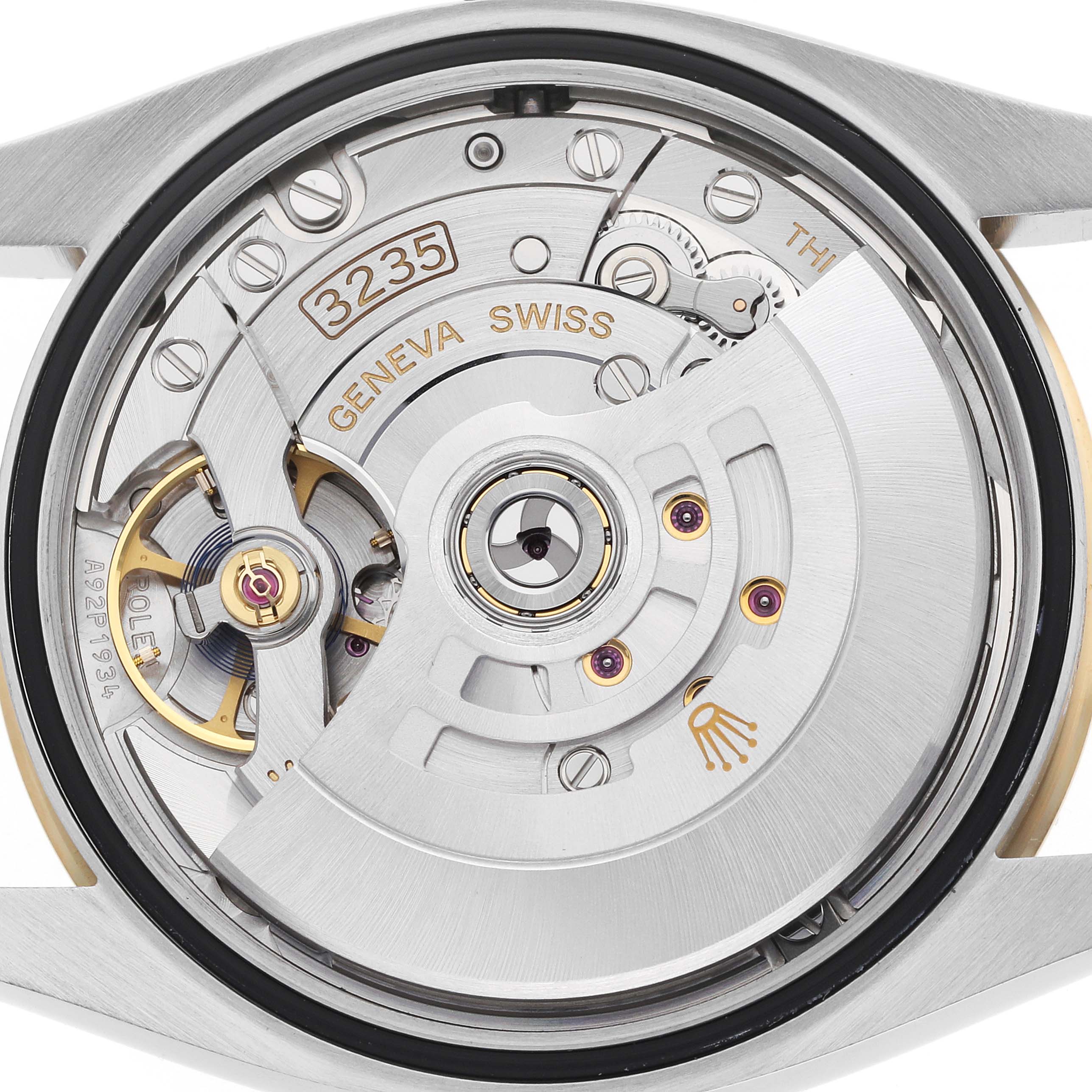 The image shows a close-up of the Rolex Datejust 126233 Men's Steel and Gold (two tone) Silver Dial movement from the back, highlighting the rotor and mechanical components.