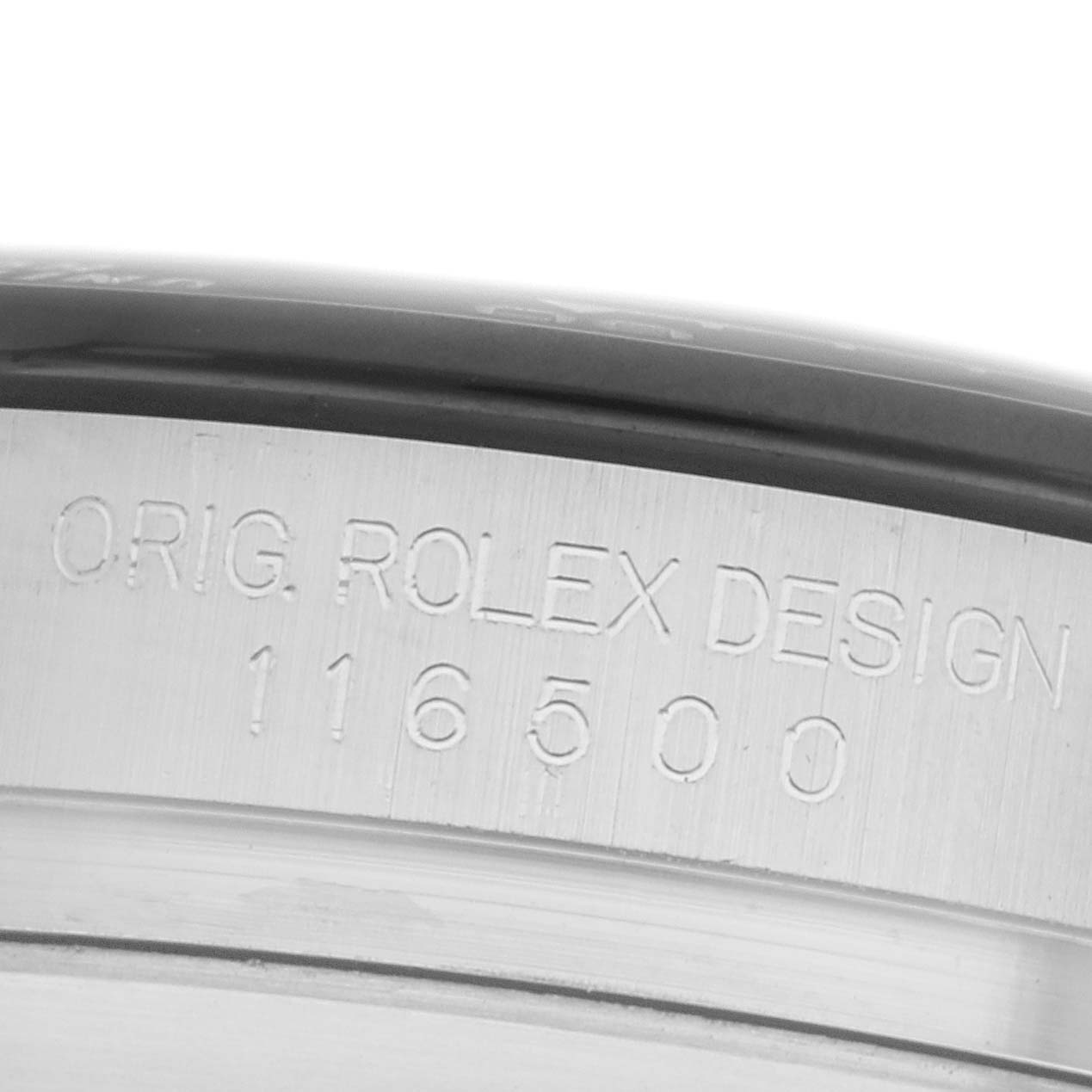 The image shows the side of the Rolex Daytona 116500 Men
s Stainless Steel White Dial watch case, featuring the engraved model number "116500."