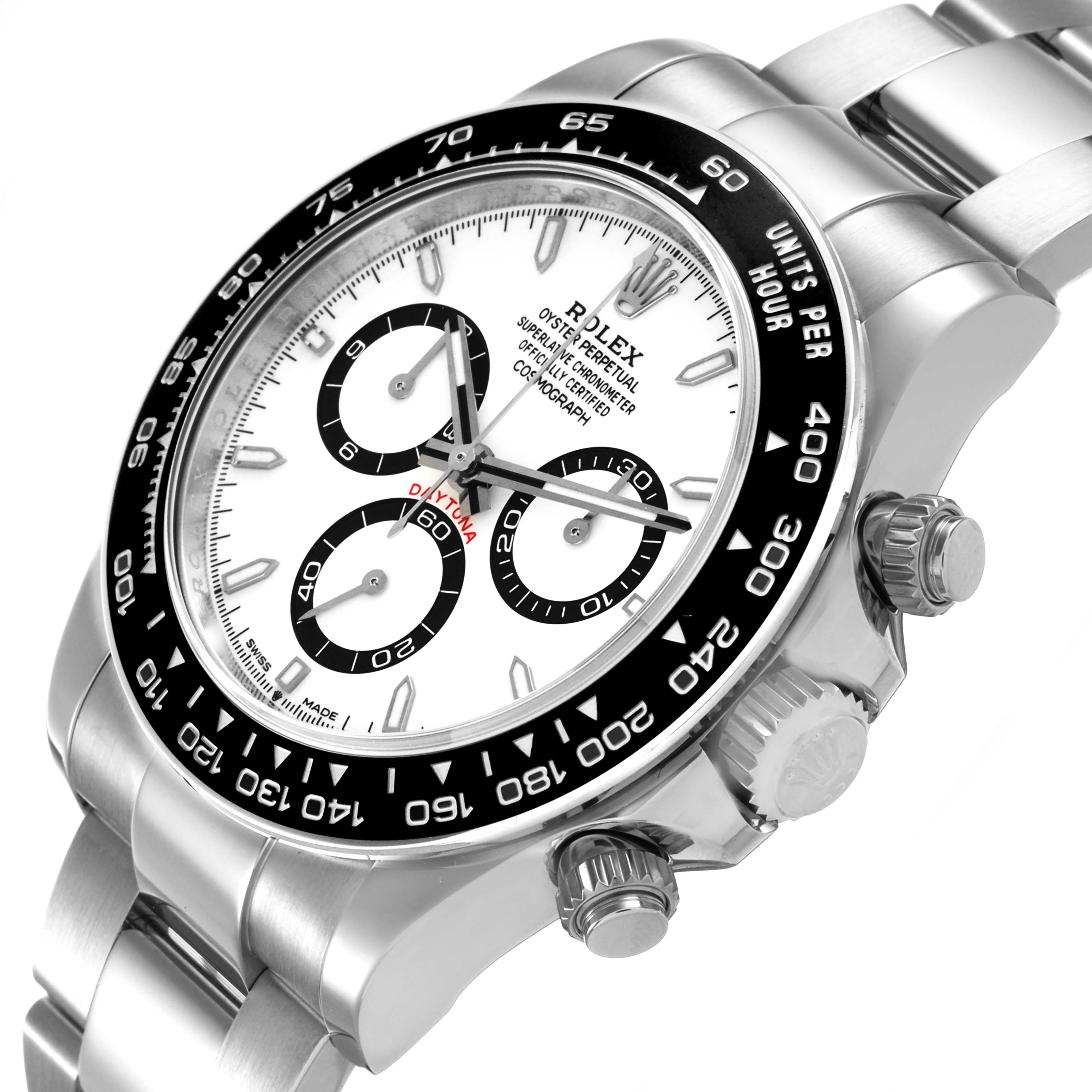 The Rolex Daytona 126500 Men's Stainless Steel White Dial watch is shown at an angled side view displaying the dial, bezel, crown, and pushers.