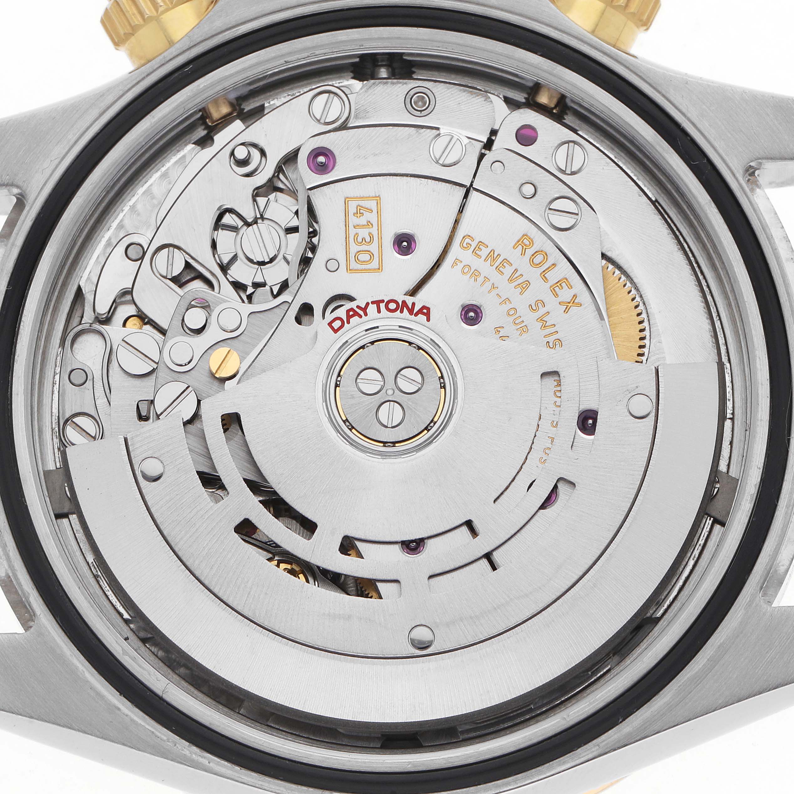 The image shows a close-up of the Rolex Daytona 116523 Men
s Steel and Gold (two tone) Black Dial watch movement from the back, highlighting the rotor and mechanical components.