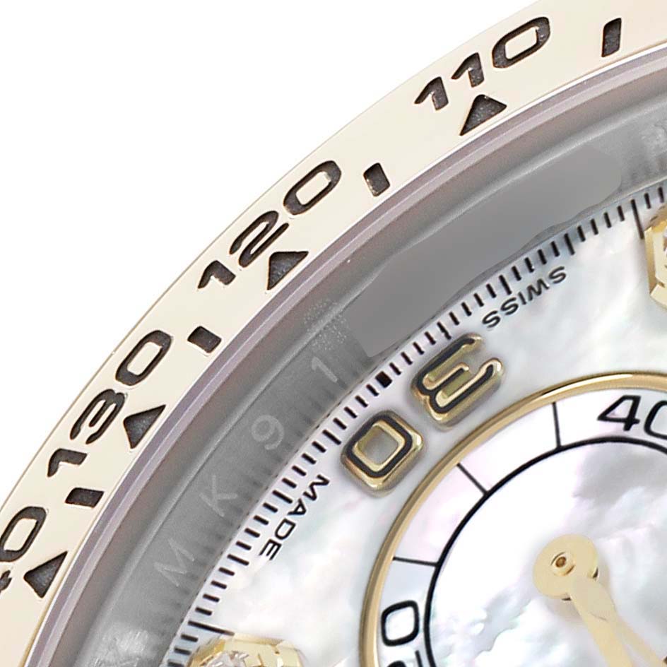 The image shows a close-up of the Rolex Daytona 116503 Men
s Steel and Gold (two tone) Mother of Pearl Dial
s bezel, dial, and part of the sub-dials at an oblique angle.