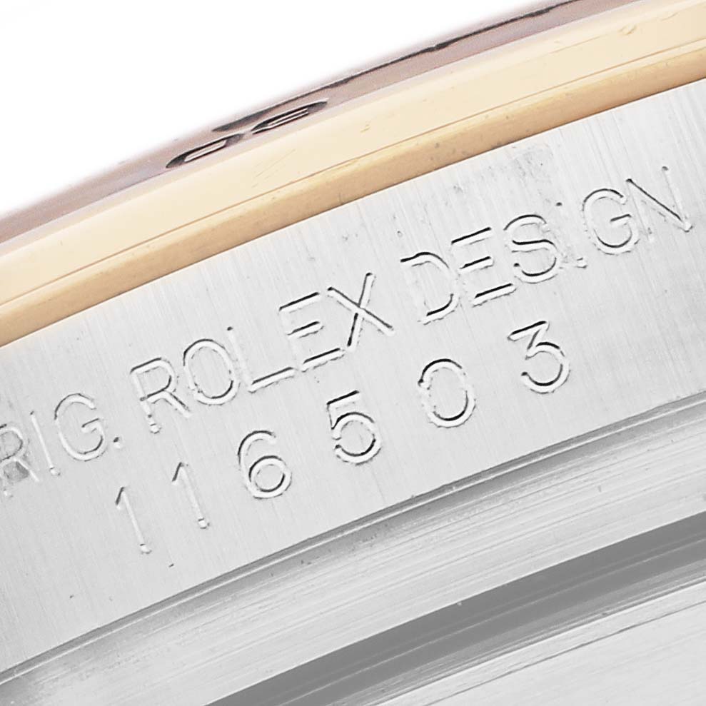 The image shows a close-up of the side engraving on a Rolex Daytona 116503 Men
s Steel and Gold (two tone) Mother of Pearl Dial, revealing the model number and design details.