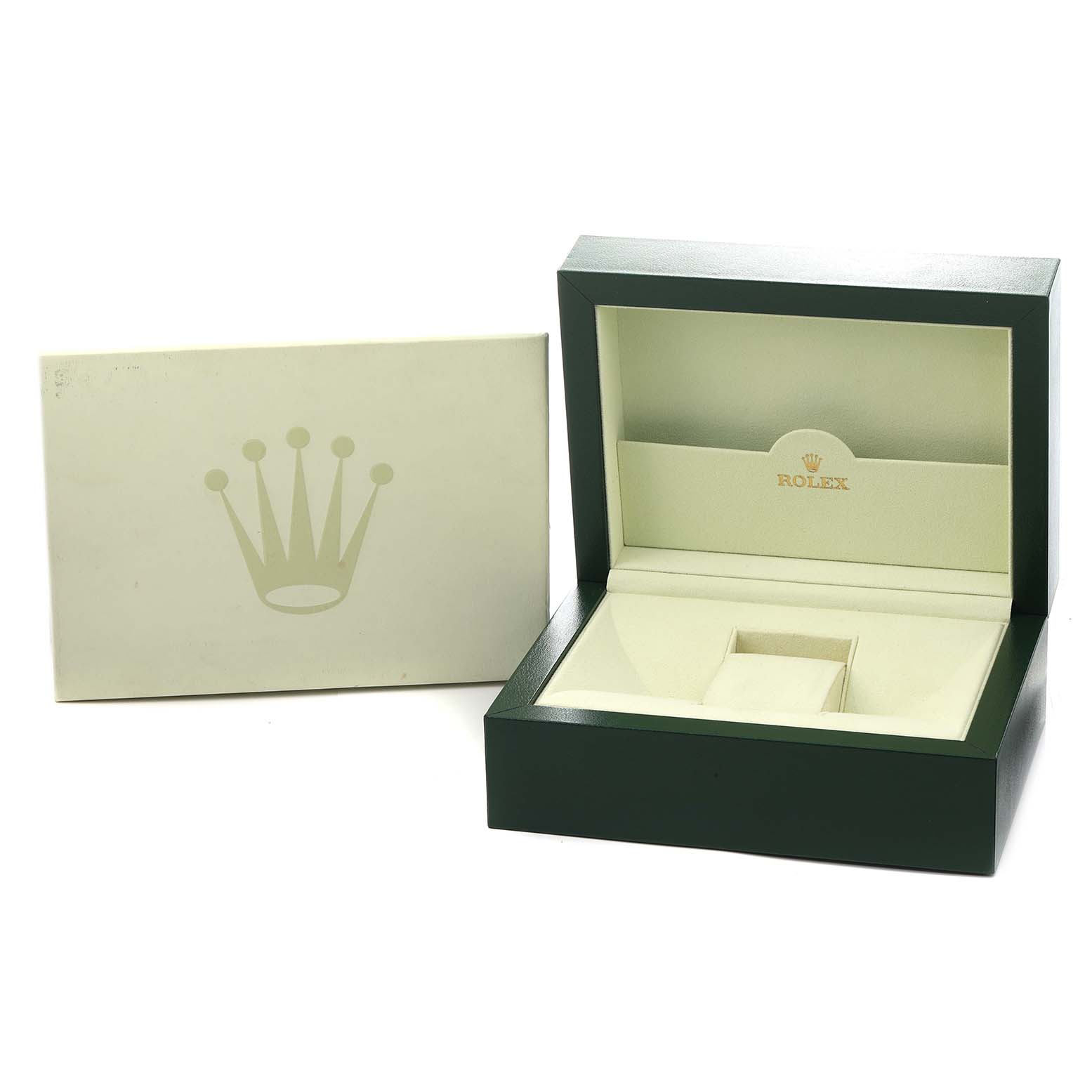 The image shows an open Rolex watch box and an exterior box, likely for the Daytona model.