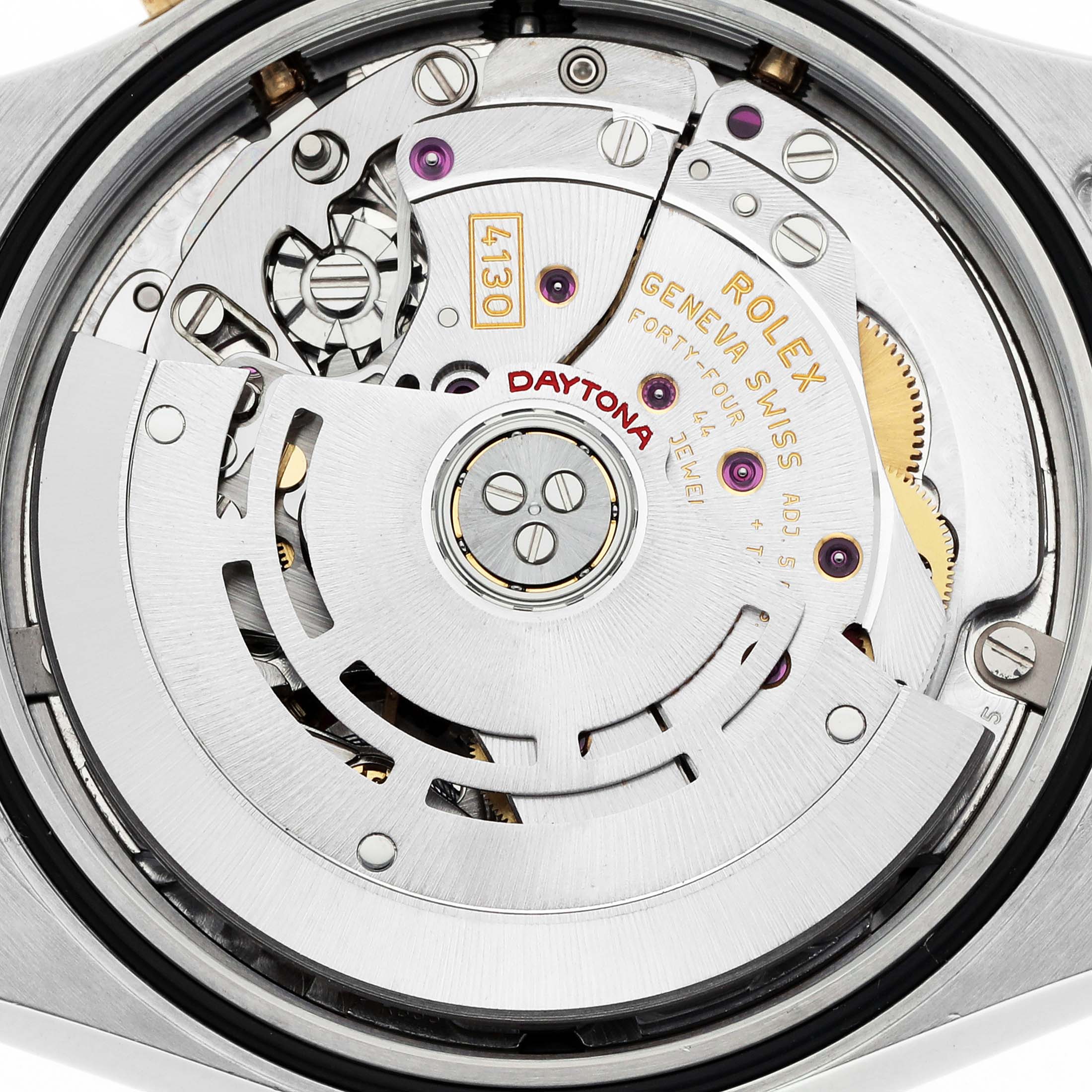 The image shows the movement of a Rolex Daytona 116523 Men's Steel and Gold (two tone) White Dial watch from the back, highlighting the rotor and intricate mechanisms.