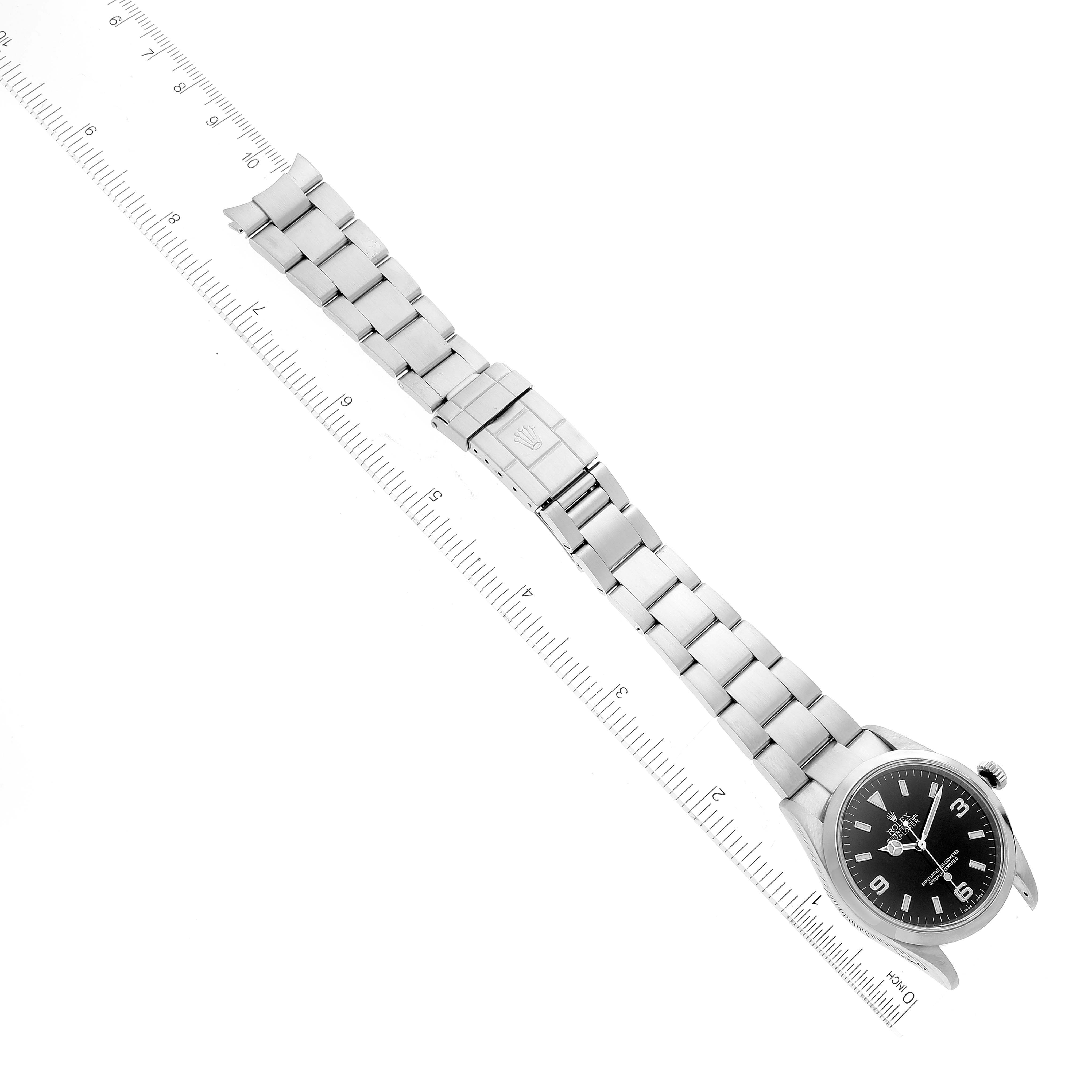 The image shows a Rolex Explorer 114270 Men's Stainless Steel Black Dial 114270 Men's Stainless Steel Black Dial watch laid flat, displaying the face, bezel, bracelet, and clasp at an oblique angle.