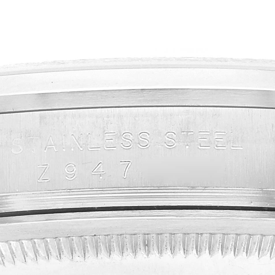 The image shows a close-up of the stainless steel side casing with engraved details of a Rolex Explorer 114270 Men's Stainless Steel Black Dial 114270 Men's Stainless Steel Black Dial watch.