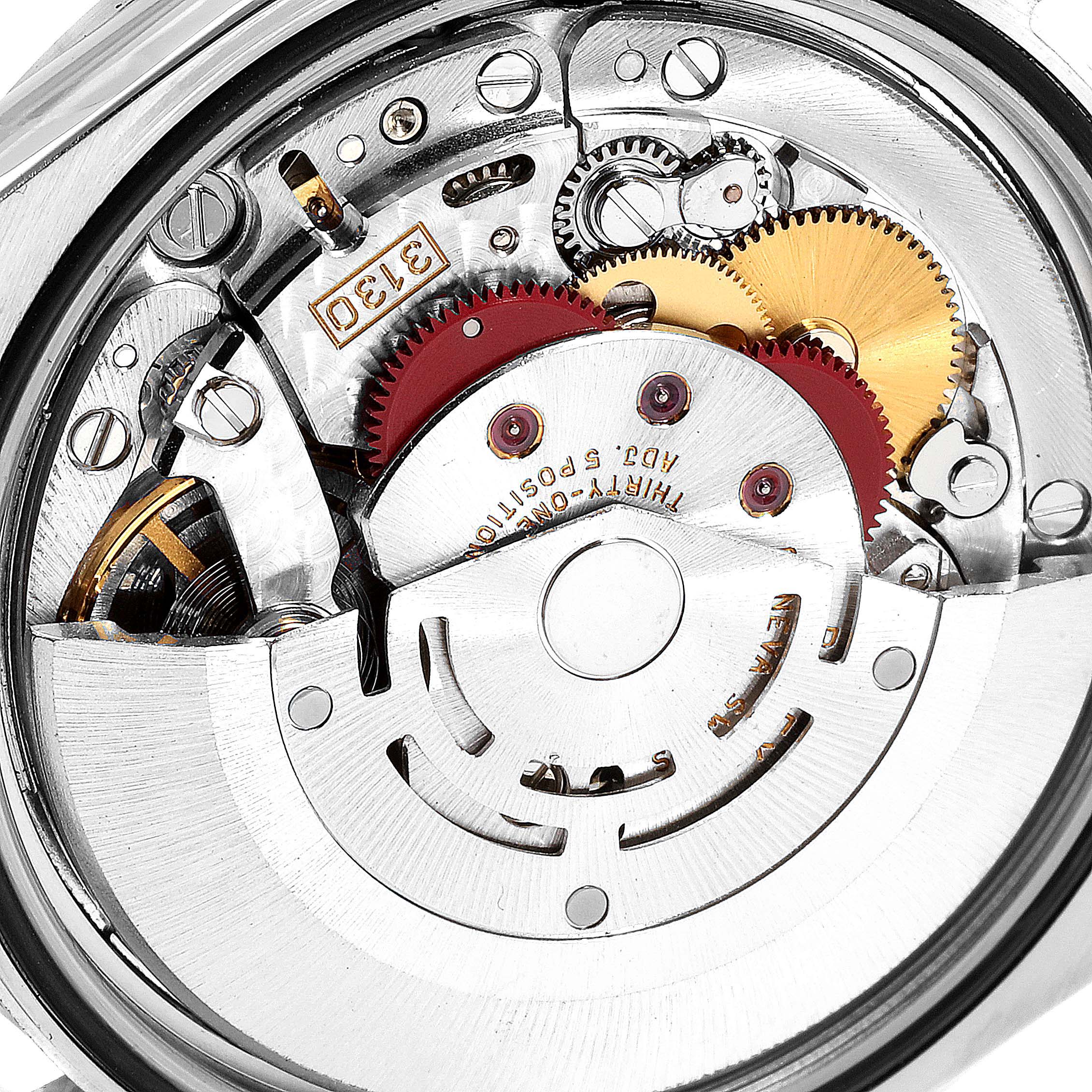 This close-up image shows the intricate mechanical movement and gears inside a Rolex Explorer 114270 Men
s Stainless Steel Black Dial 114270 Men
s Stainless Steel Black Dial watch.