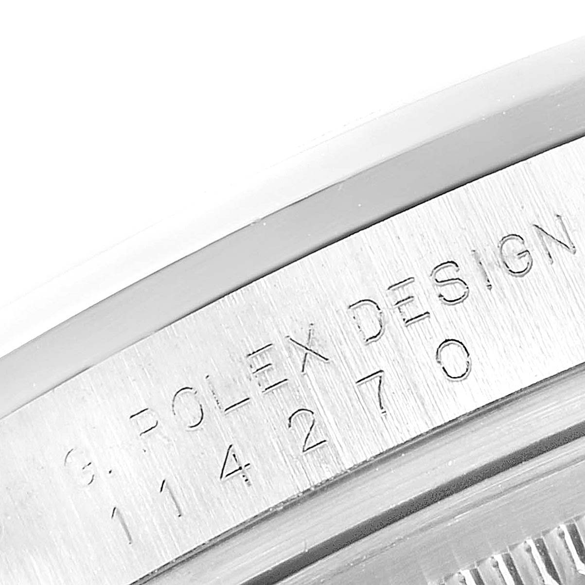 This close-up image shows the serial number engraving on the metal case side of a Rolex Explorer 114270 Men
s Stainless Steel Black Dial 114270 Men
s Stainless Steel Black Dial watch.