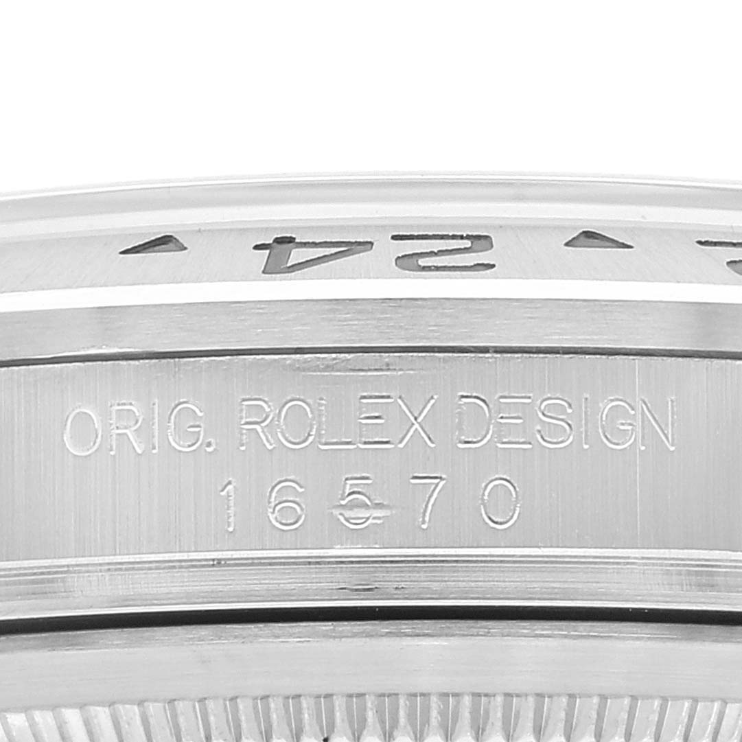 The image shows a close-up of the bezel and engraved model number "16570" of the Rolex Explorer 16570 Men's Stainless Steel White Dial 16570 Men's Stainless Steel White Dial watch.
