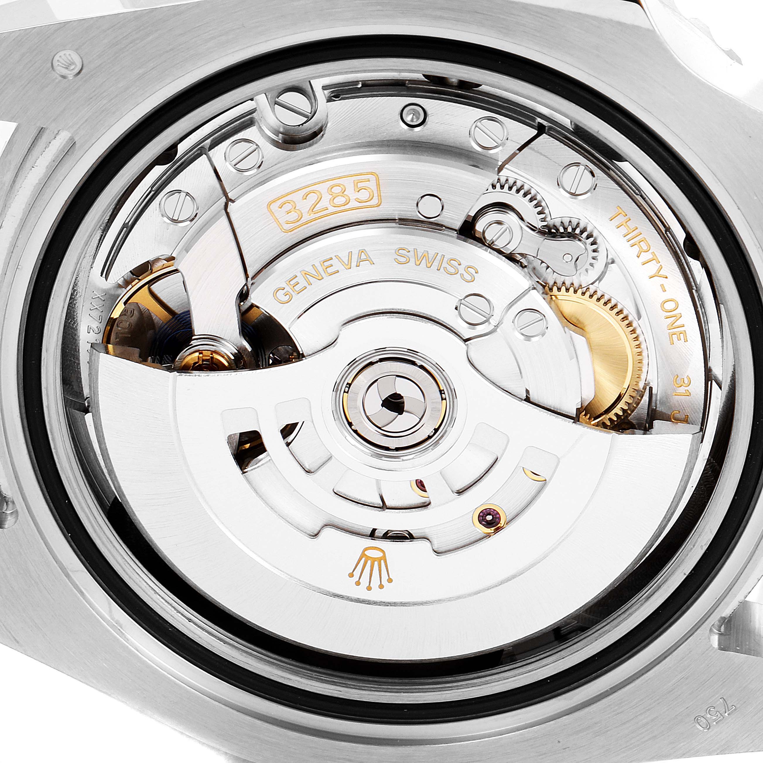 This image shows the intricate movement and mechanics of a Rolex GMT-Master 126719 Men's White Gold Blue Dial 126719 Men's White Gold Blue Dial watch, highlighting the automatic winding rotor and inner gears.