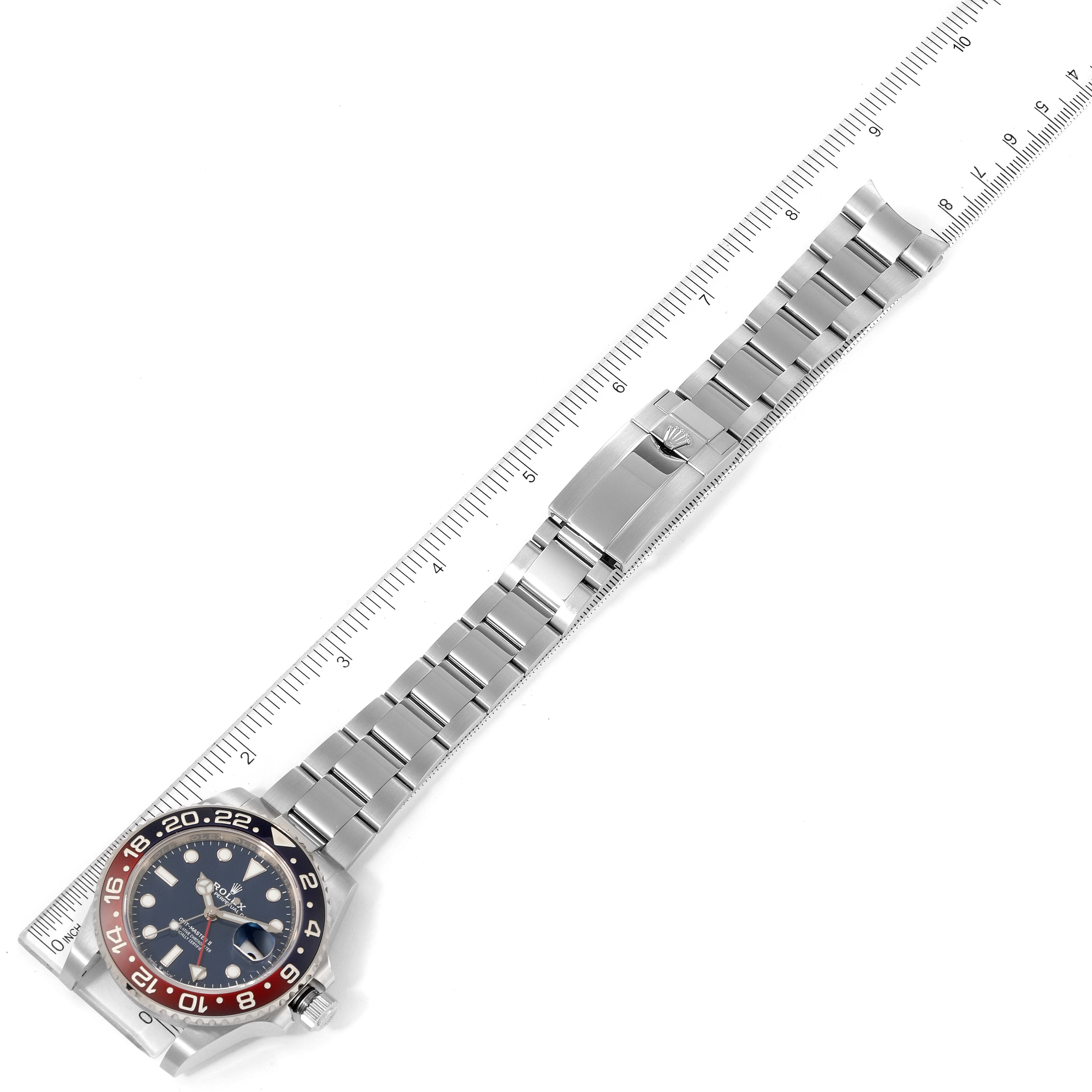 The image shows a Rolex GMT-Master 126719 Men's White Gold Blue Dial 126719 Men's White Gold Blue Dial watch laid flat, showcasing its bracelet, clasp, bezel, and face with a measuring scale.