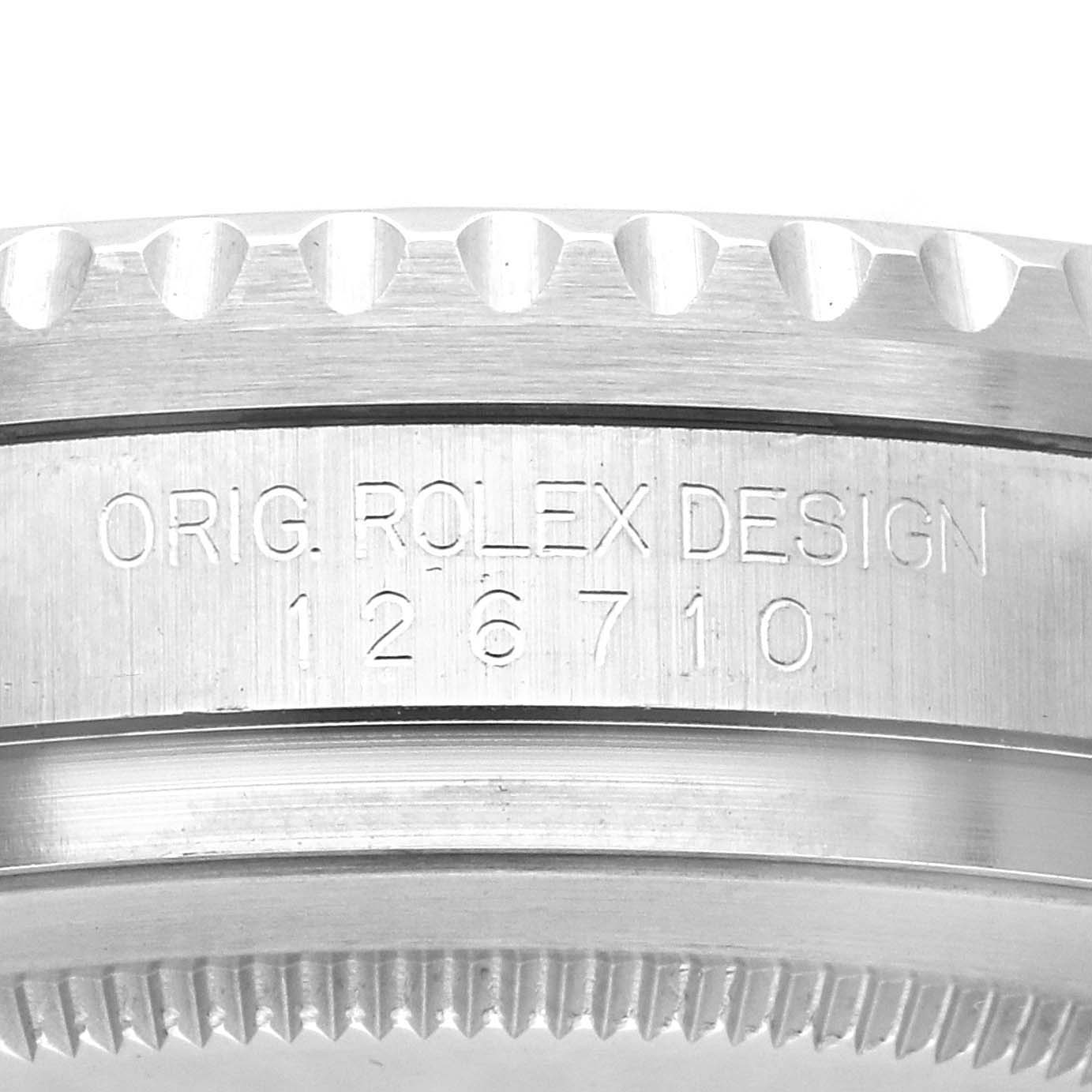 The image shows a close-up side view of a Rolex GMT-Master 126710 Men
s Stainless Steel Black Dial
s case with model engraving "126710" and text "ORIG. ROLEX DESIGN."