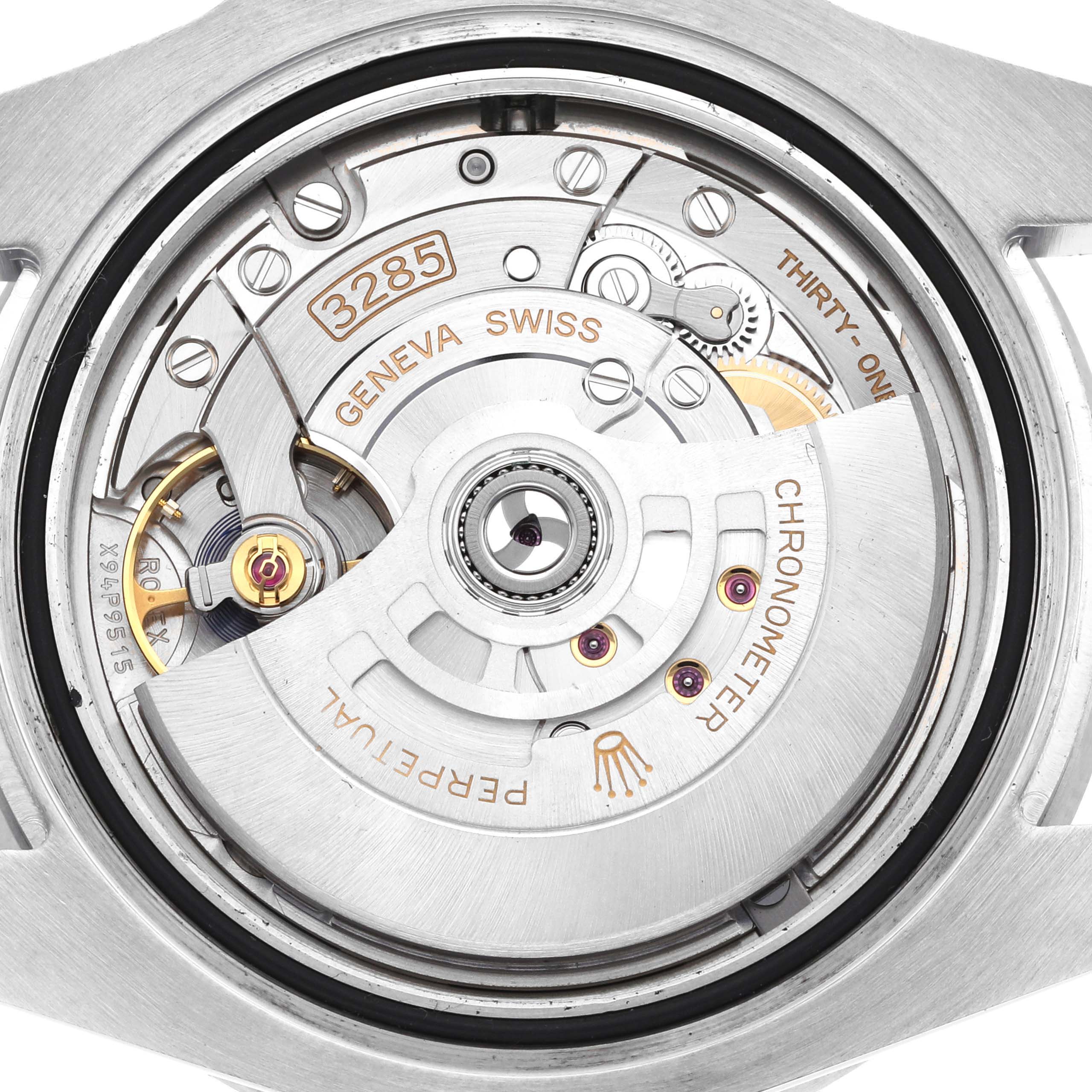 The image shows the movement of a Rolex GMT-Master 126710 Men
s Stainless Steel Black Dial from the back, highlighting the rotor, balance wheel, and engravings.