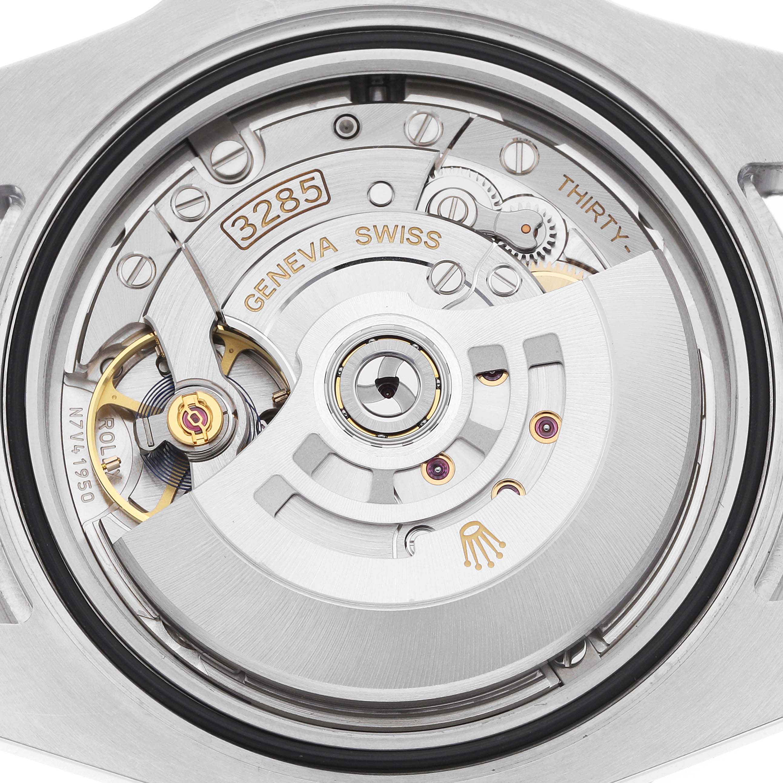 The image shows the movement of a Rolex GMT-Master 126710 Men
s Stainless Steel Black Dial, viewed from the back, highlighting its intricate mechanical components.