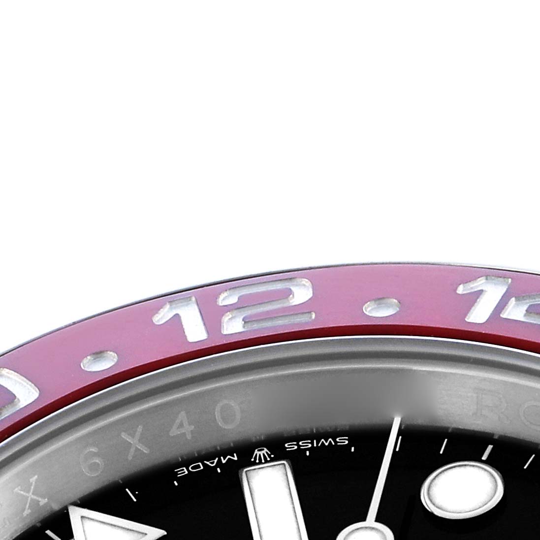 The image shows a partial view of the bezel and dial of a Rolex GMT-Master 126710 Men
s Stainless Steel Black Dial, focusing on the upper section with numbers and indices.