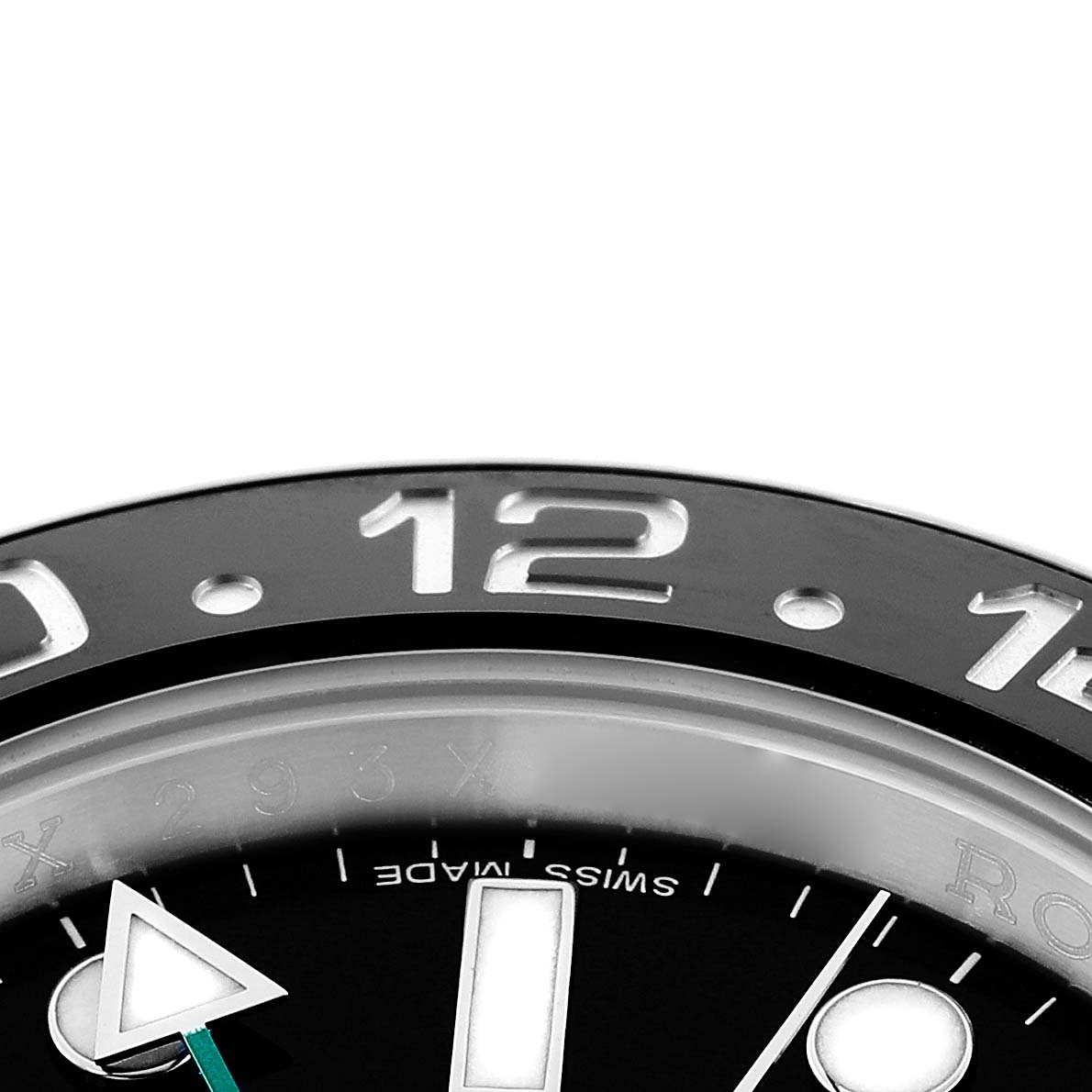 The image shows a close-up of the bezel and dial of a Rolex GMT-Master 116710 Men
s Stainless Steel Black Dial, highlighting the 12 o
clock marker and "Swiss Made" text.