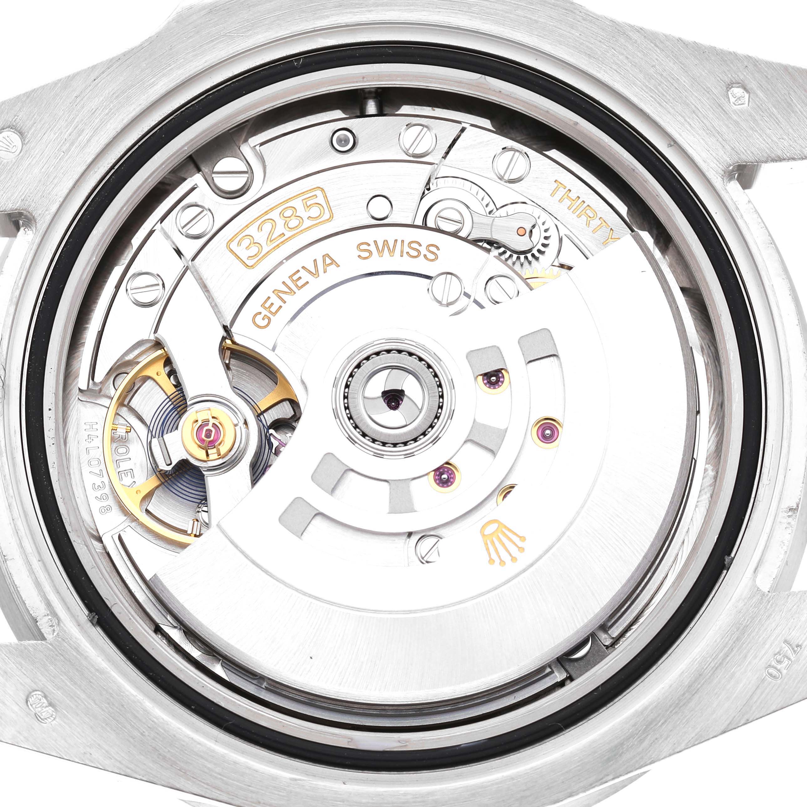 The image shows the movement mechanism of a Rolex GMT-Master 126719BLRO Men's White Gold Silver Dial from the back, highlighting the rotor and fine details.