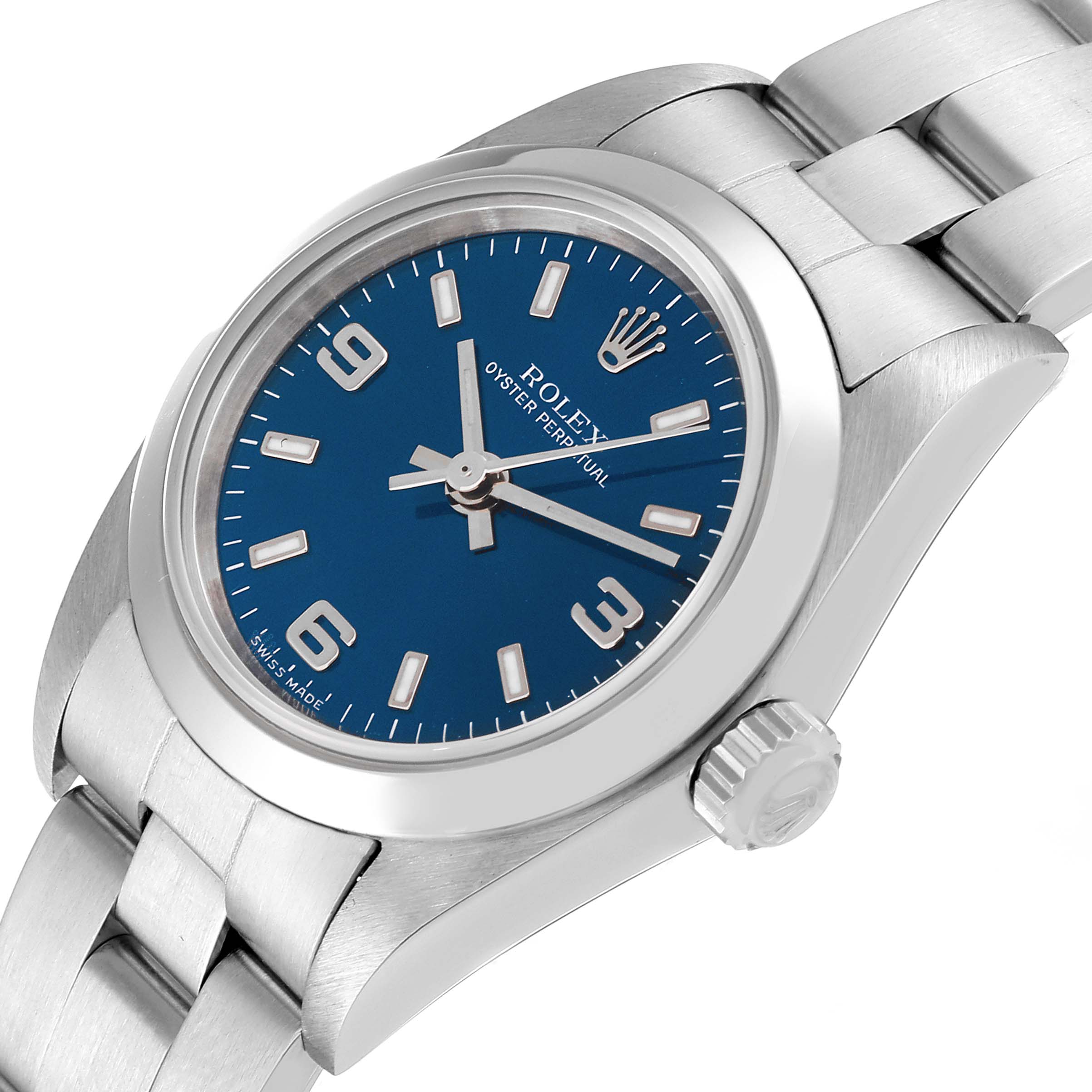 The image shows a close-up angle of a Rolex Oyster Perpetual 76080 Women's Stainless Steel Blue Dial 76080 Women's Stainless Steel Blue Dial watch, focusing on the blue dial, bezel, crown, and bracelet.