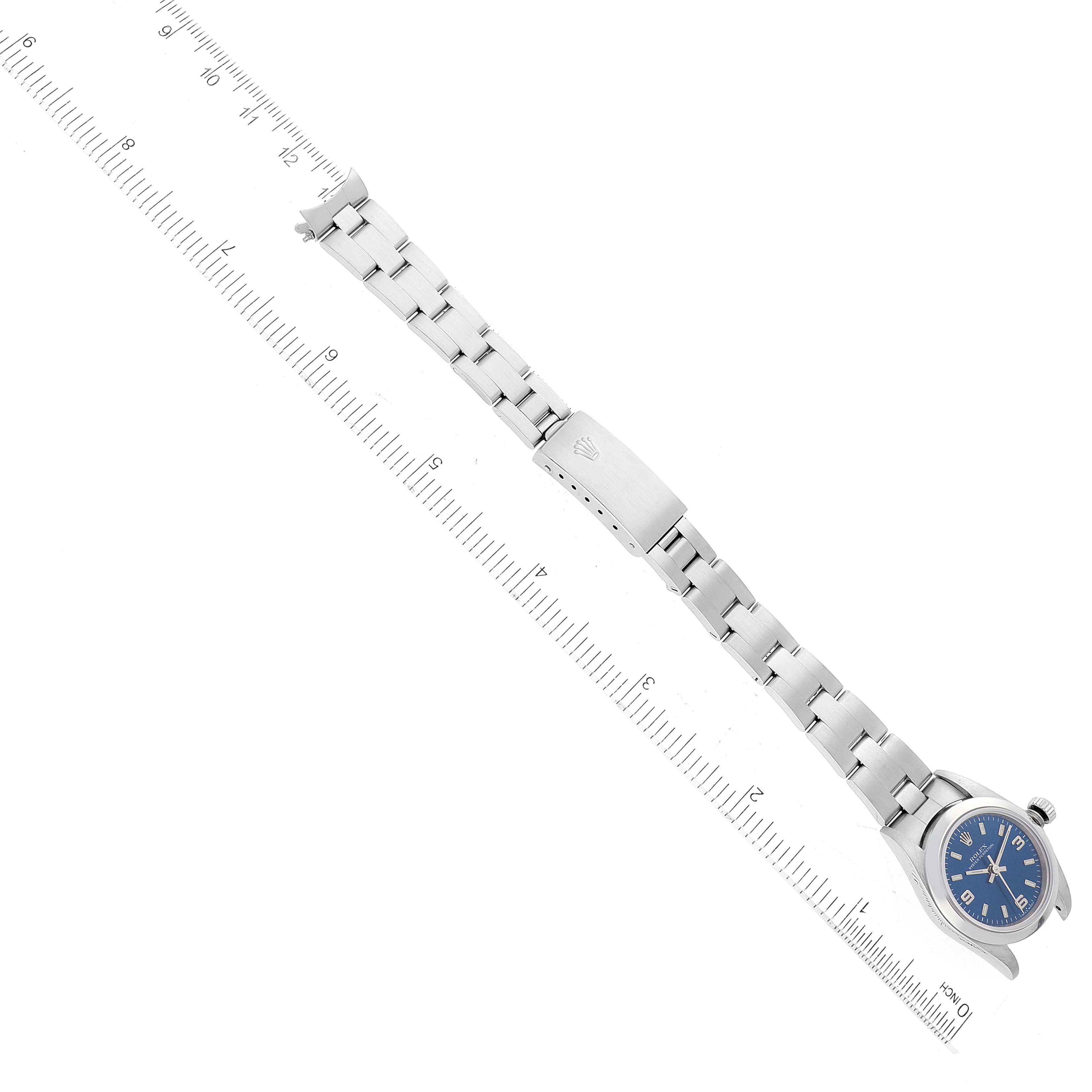 This image shows a top-down view of the Rolex Oyster Perpetual 76080 Women's Stainless Steel Blue Dial 76080 Women's Stainless Steel Blue Dial watch with a blue dial, also featuring the full stainless steel bracelet.