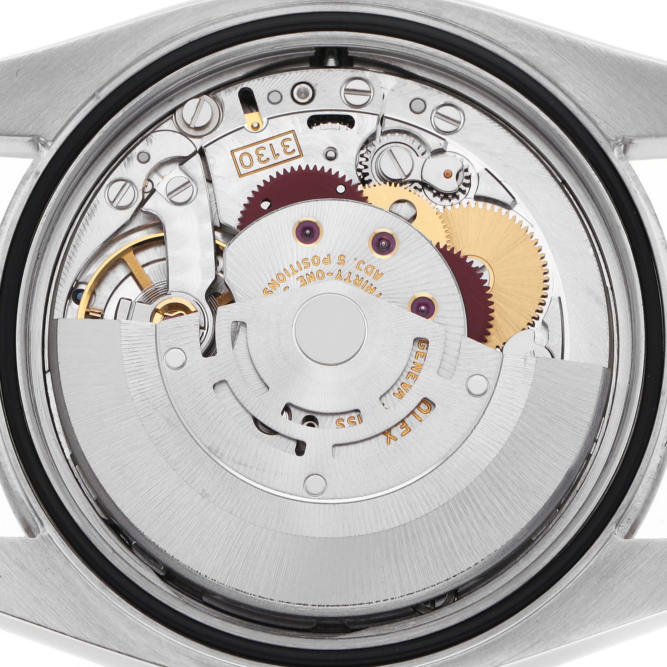 The image shows the back view of a Rolex Oyster Perpetual 116034 Men
s Stainless Steel Silver Dial watch, highlighting its internal movement components.