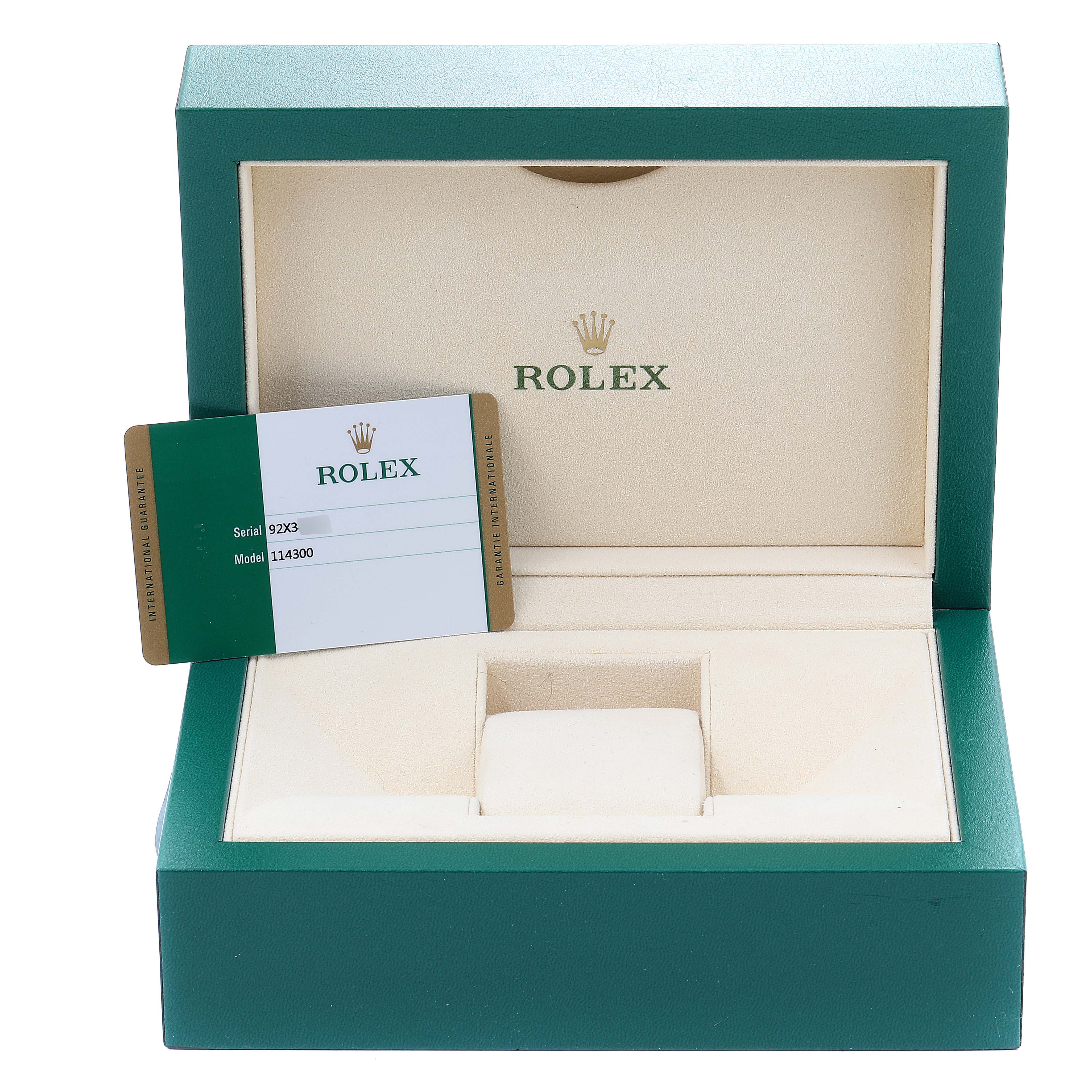 The image shows an open green Rolex box for an Oyster Perpetual model, along with its certificate card.