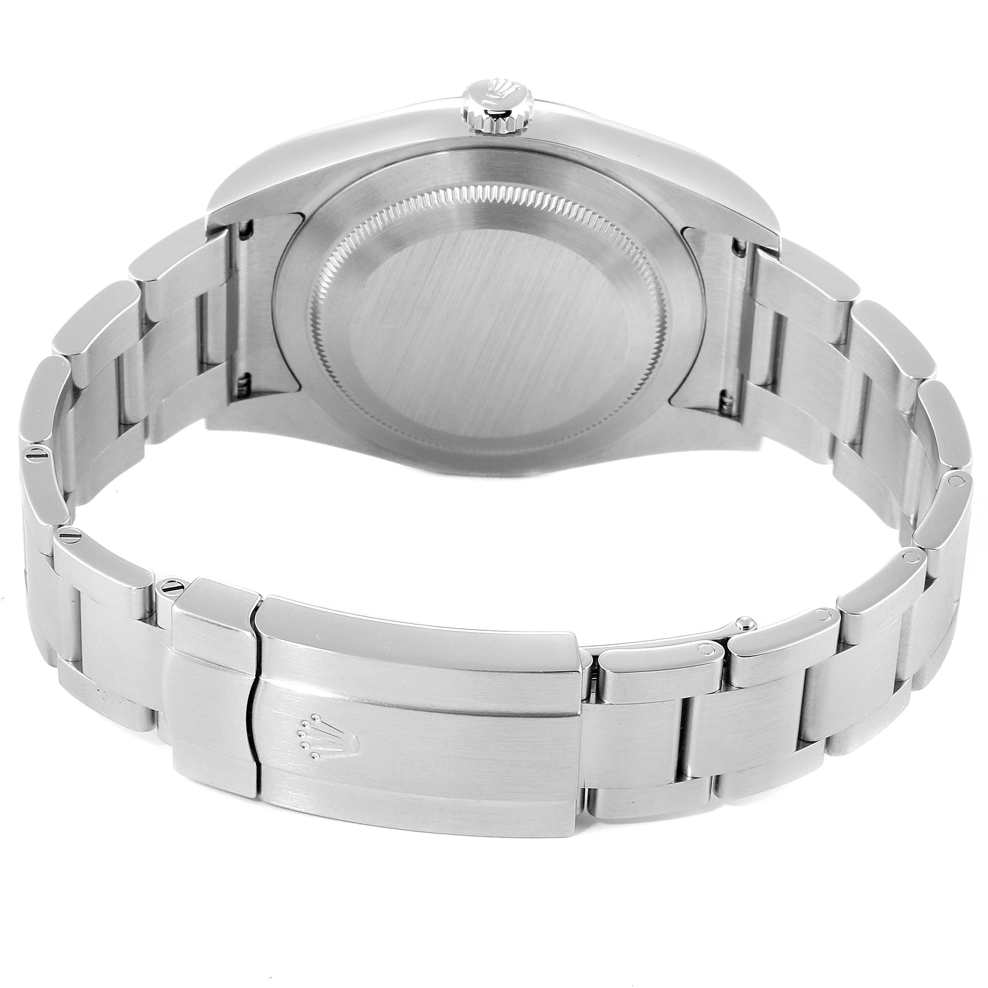 The image shows the back view of a Rolex Oyster Perpetual 114300 Men's Stainless Steel Blue Dial 114300 Men's Stainless Steel Blue Dial watch, focusing on the case back and bracelet.