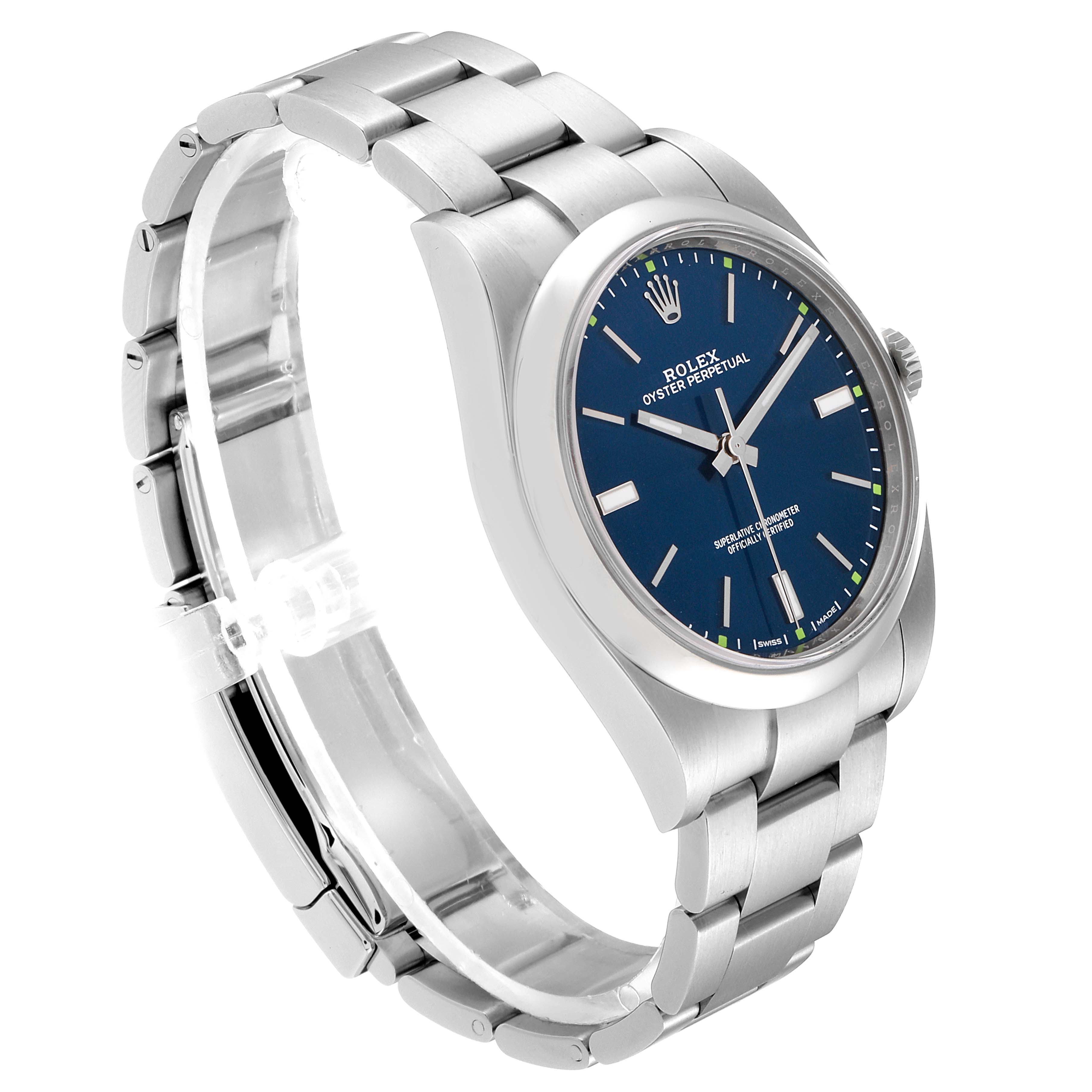 The image shows a side angle of the Rolex Oyster Perpetual 114300 Men's Stainless Steel Blue Dial 114300 Men's Stainless Steel Blue Dial watch, displaying its metal bracelet, crown, and blue dial.