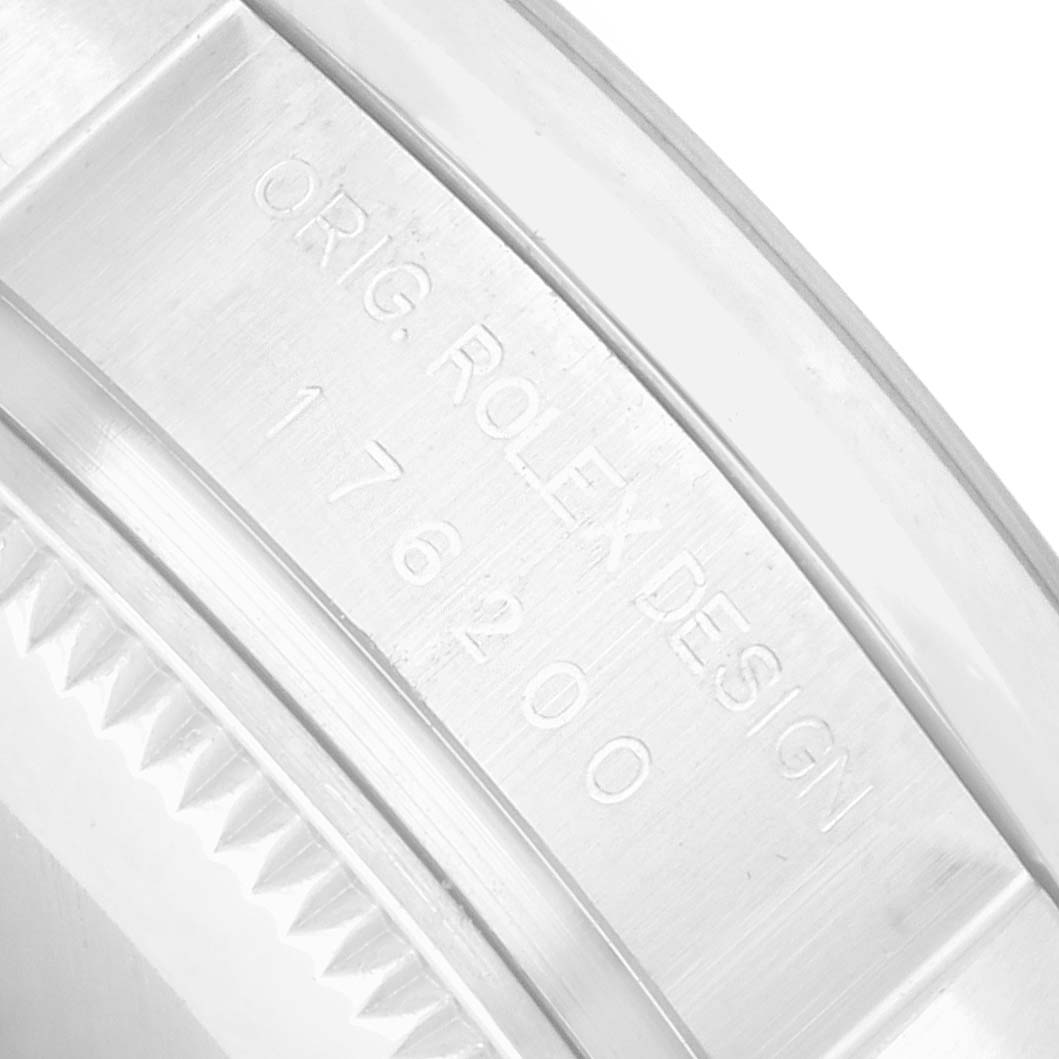 The image shows a close-up of the inner bezel with engravings on a Rolex Datejust 176200 Women's Stainless Steel Silver Dial watch, highlighting the model and brand.