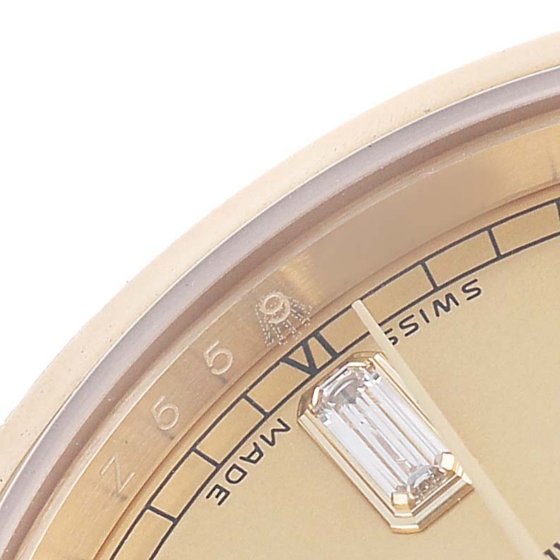 The image shows a close-up of the dial's edge and a diamond hour marker on a Rolex President 118238 Men's Yellow Gold Champagne Dial watch.