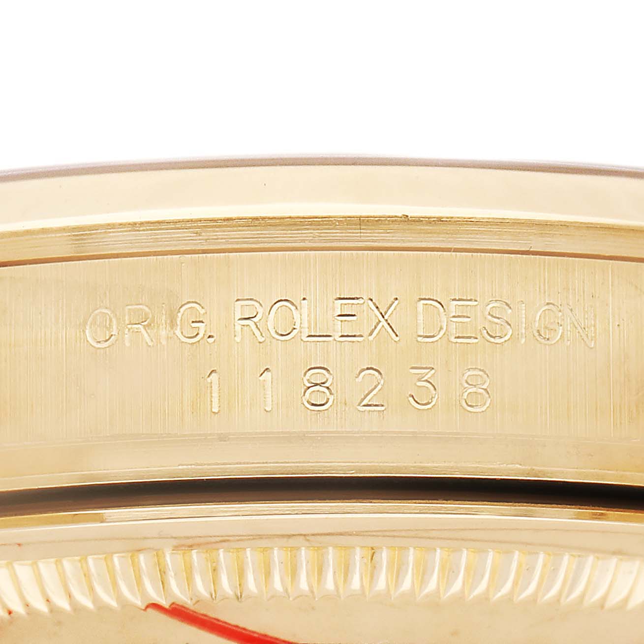 The image shows a close-up of the side of a Rolex President 118238 Men's Yellow Gold Champagne Dial model, highlighting the engraved design and model number "118238."