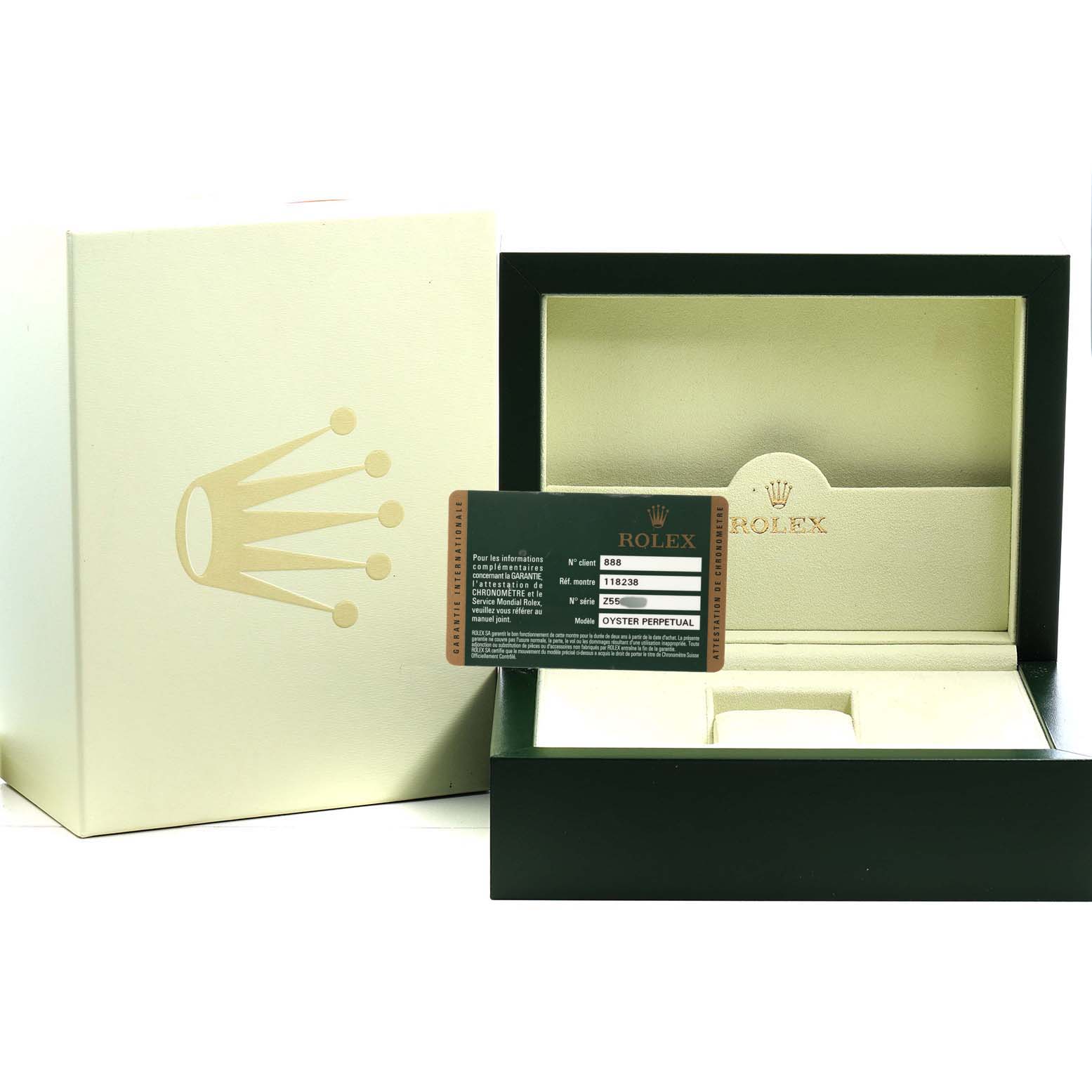 The image shows the packaging and warranty card for a Rolex President 118238 Men's Yellow Gold Champagne Dial model, with an open box and card in focus.